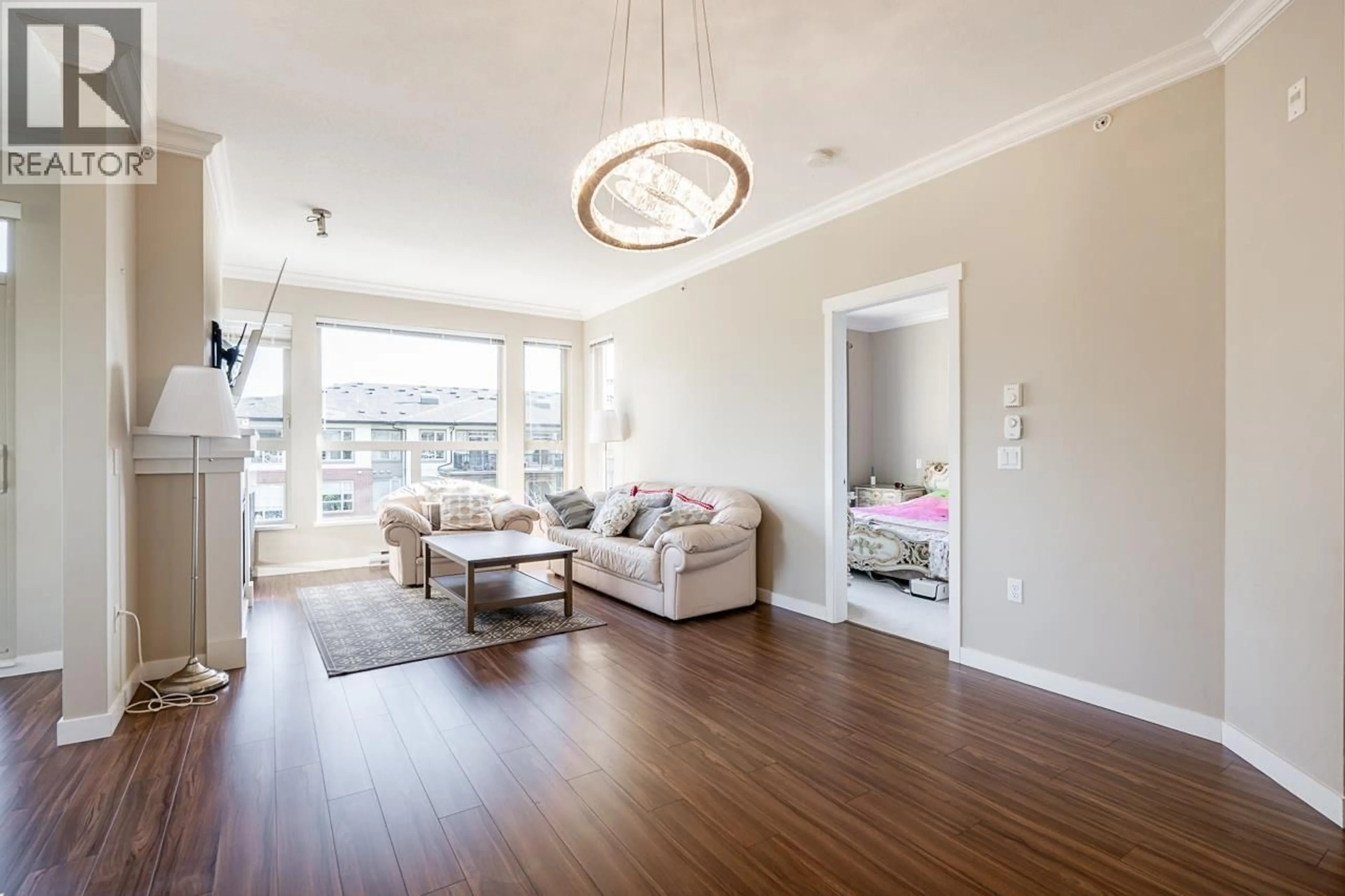 Living room with furniture, wood/laminate floor for 414 - 1150 KENSAL PLACE, Coquitlam British Columbia V3B0H4