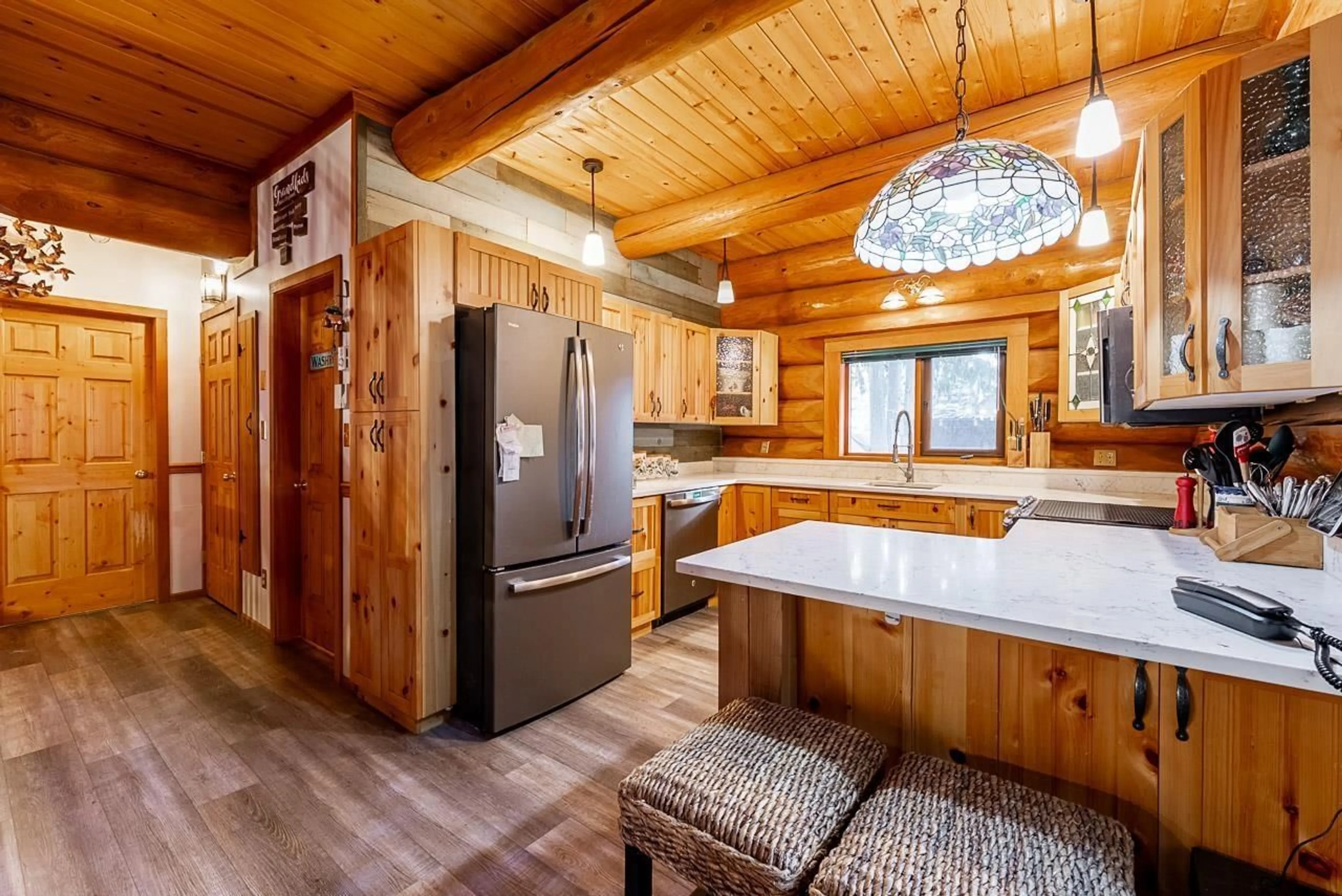 Rustic kitchen, wood/laminate floor for 71692 CONE COURT, Sunshine Valley British Columbia V0X1L5