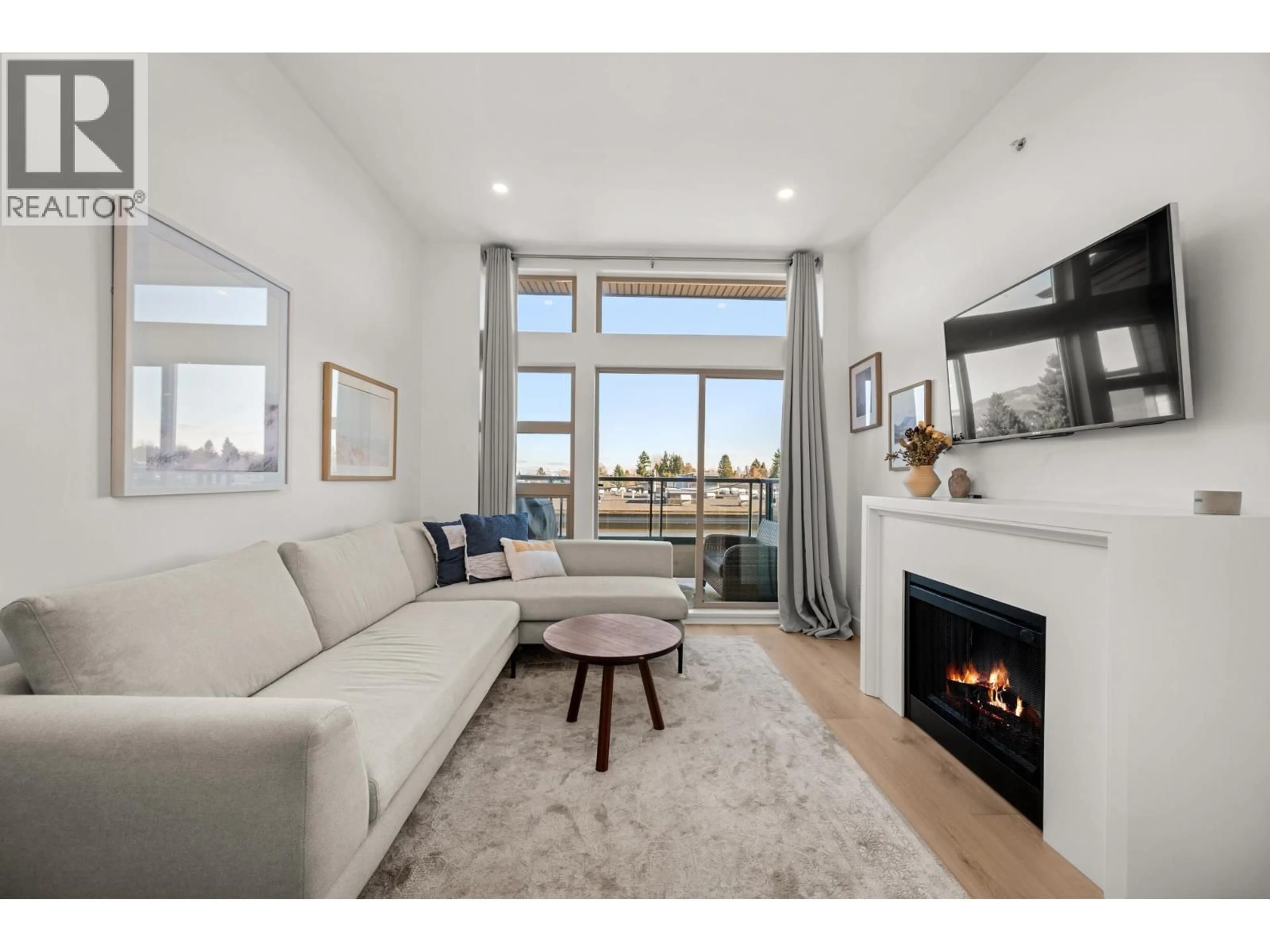 Living room with furniture, unknown for 409 - 4550 FRASER STREET, Vancouver British Columbia V5V4G8