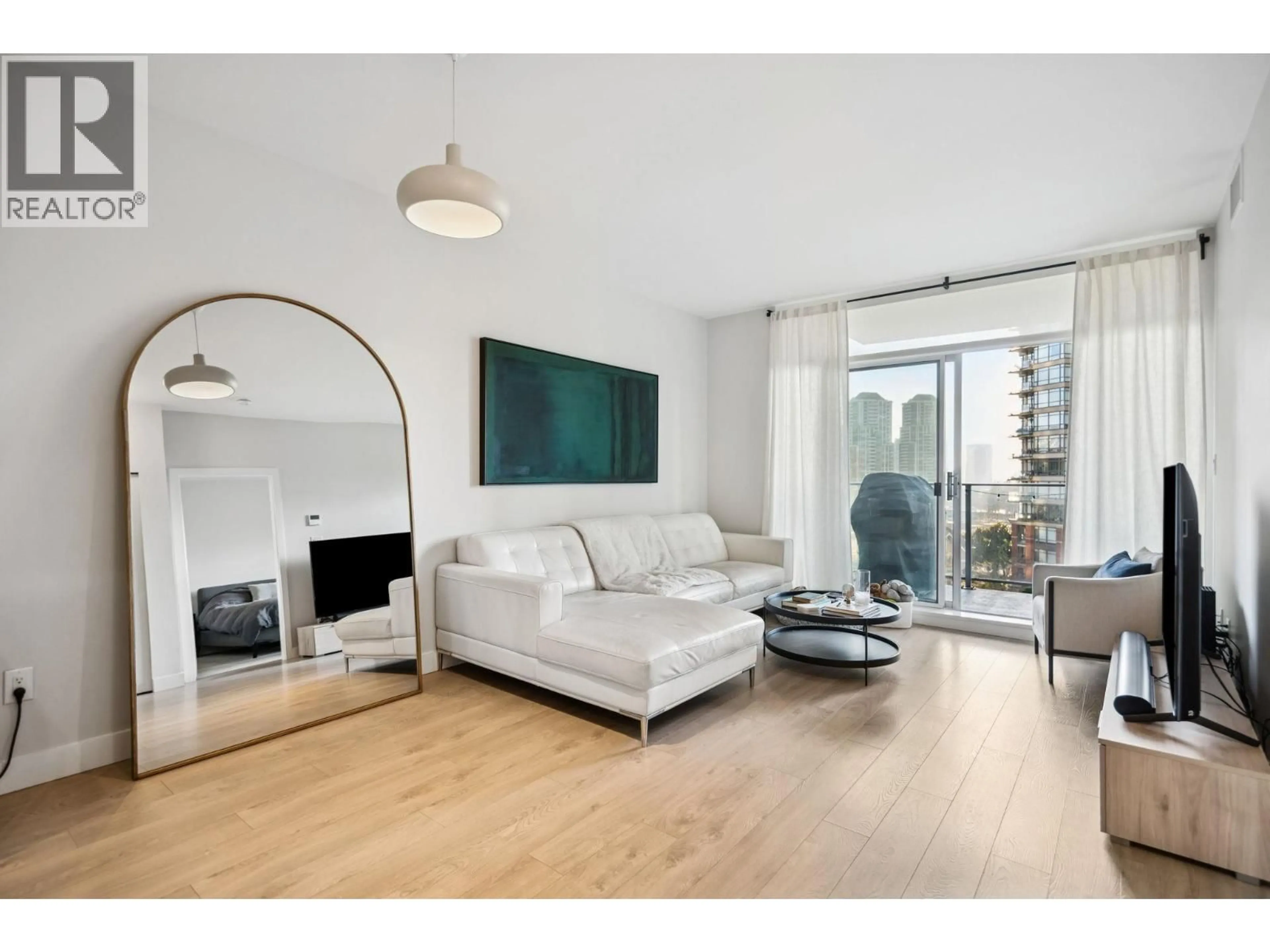 Living room with furniture, wood/laminate floor for 601 - 1788 GILMORE AVENUE, Burnaby British Columbia V5C0L5