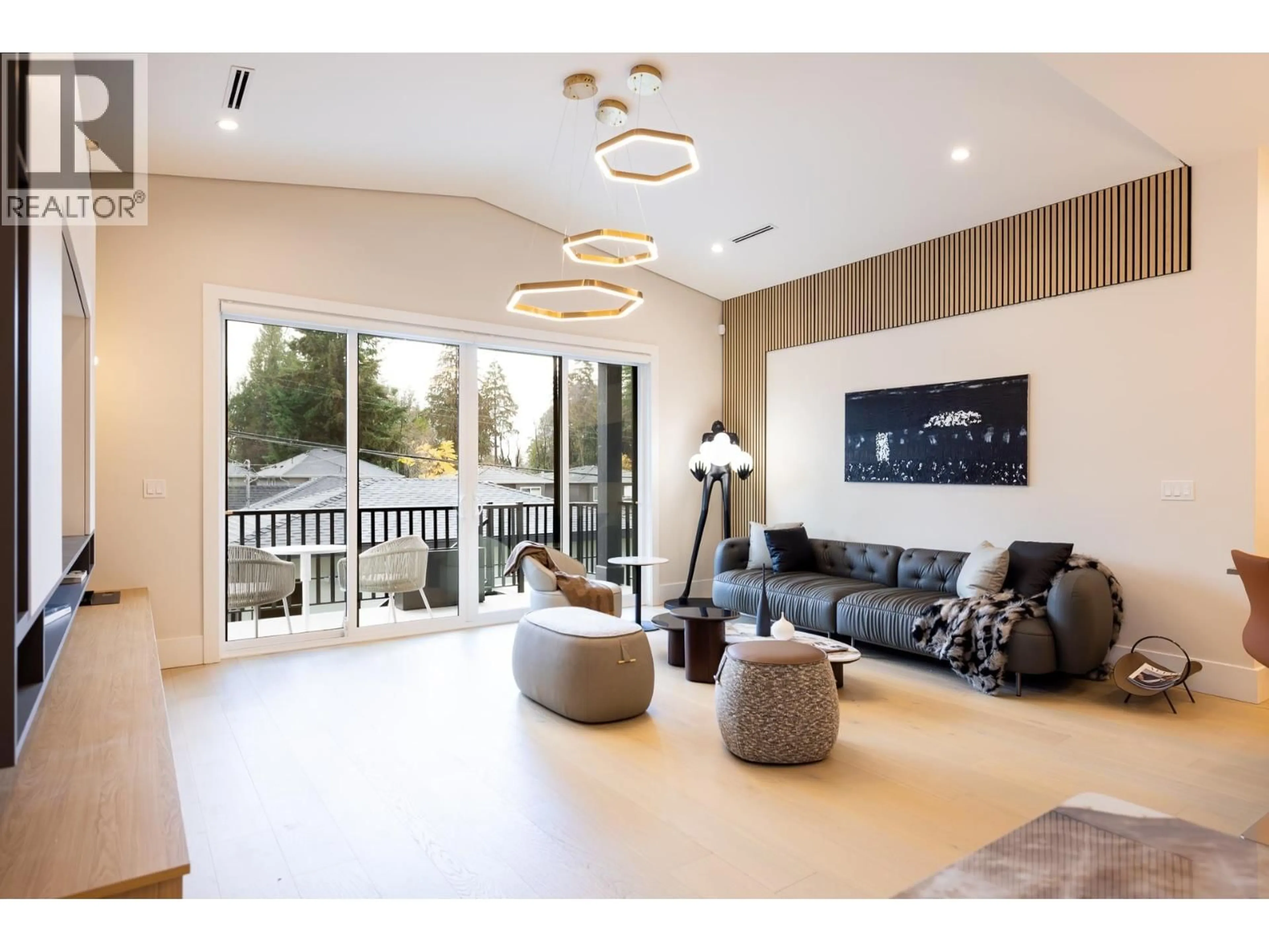 Living room with furniture, wood/laminate floor for 8055 18TH AVENUE, Burnaby British Columbia V3N1J9