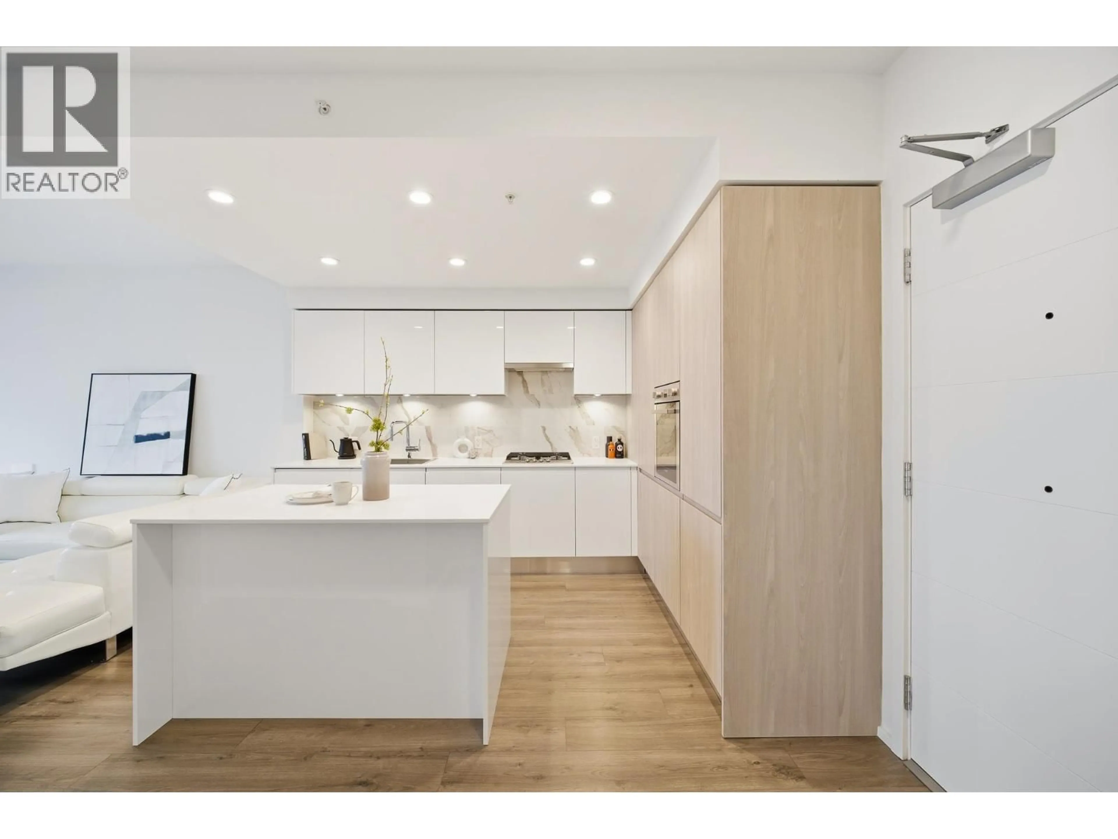 Open concept kitchen, wood/laminate floor for 507 - 3888 EVERGREEN PLACE, Burnaby British Columbia V3J0M3