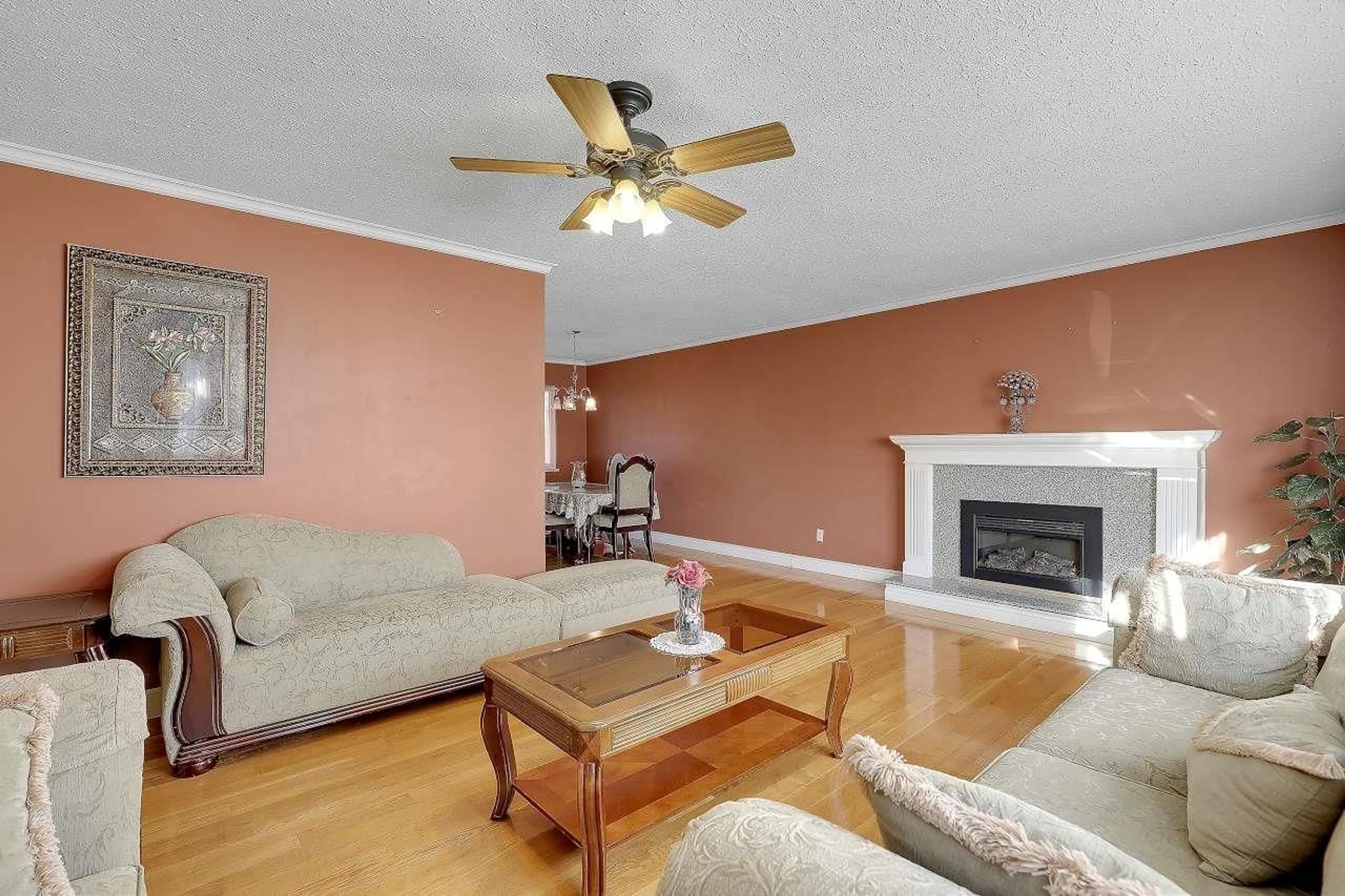 Living room with furniture, wood/laminate floor for 8947 URSUS CRESCENT, Surrey British Columbia V3V6L3