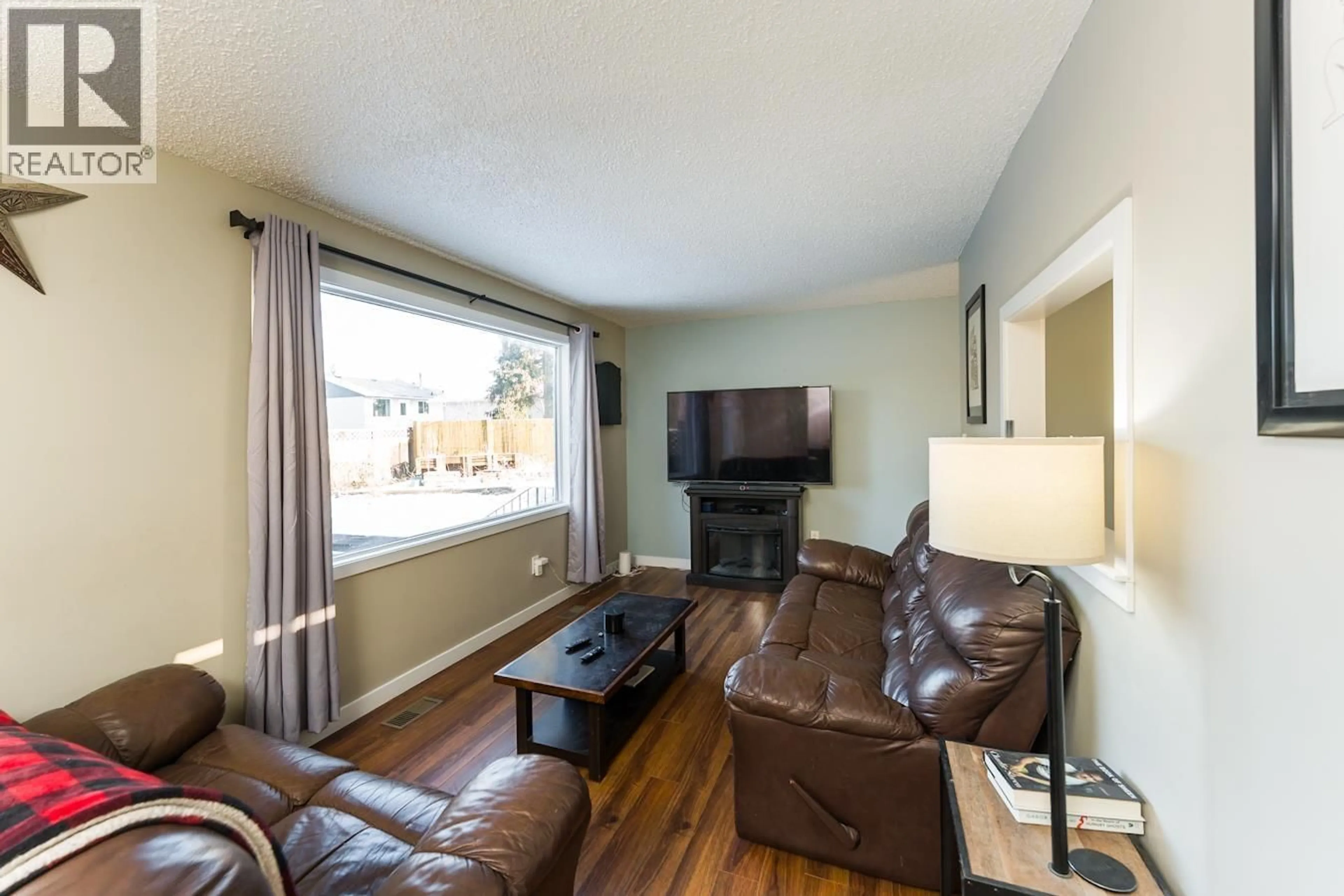 Living room with furniture, wood/laminate floor for 177 MCARTHUR PLACE, Prince George British Columbia V2M5N5