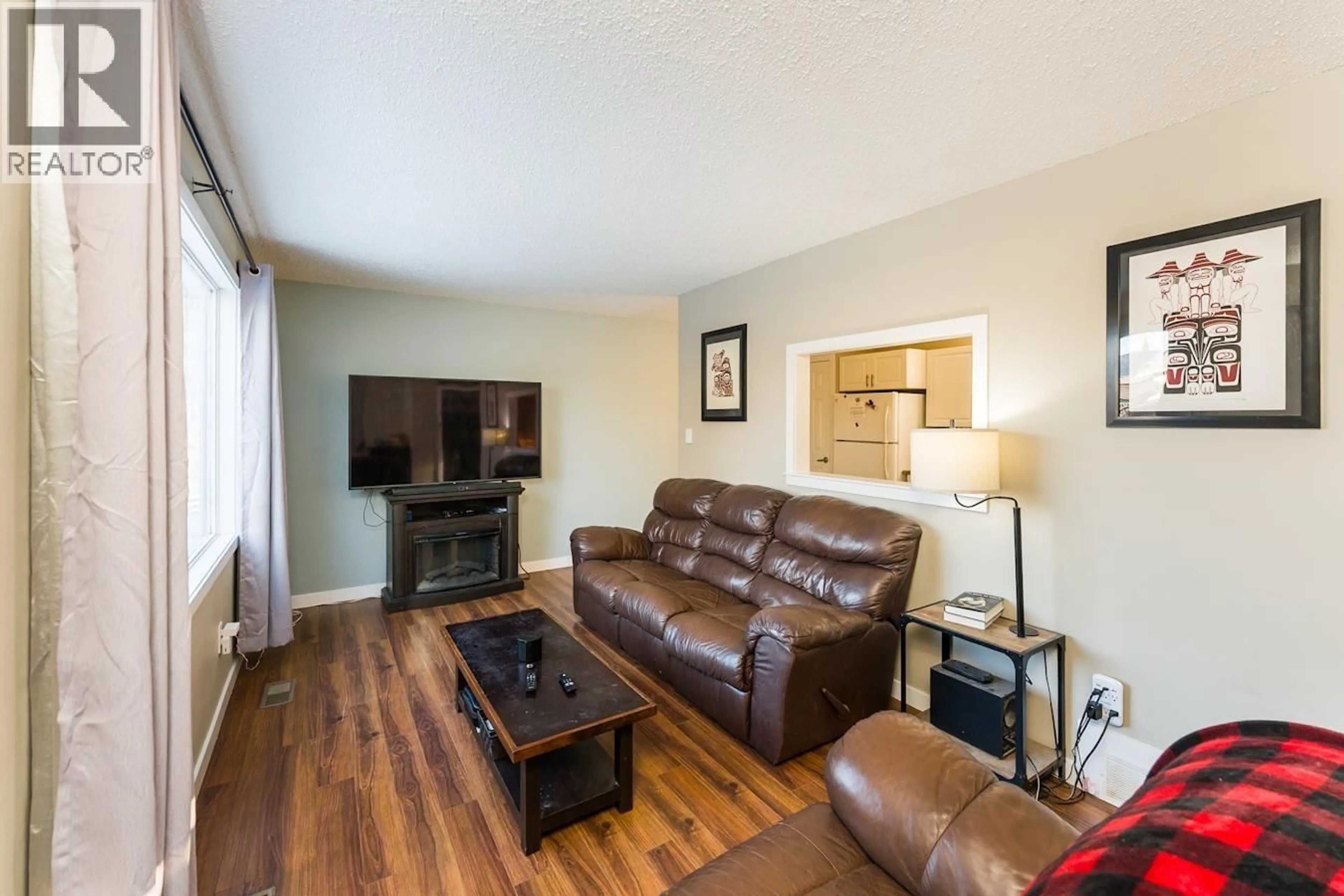 Living room with furniture, wood/laminate floor for 177 MCARTHUR PLACE, Prince George British Columbia V2M5N5