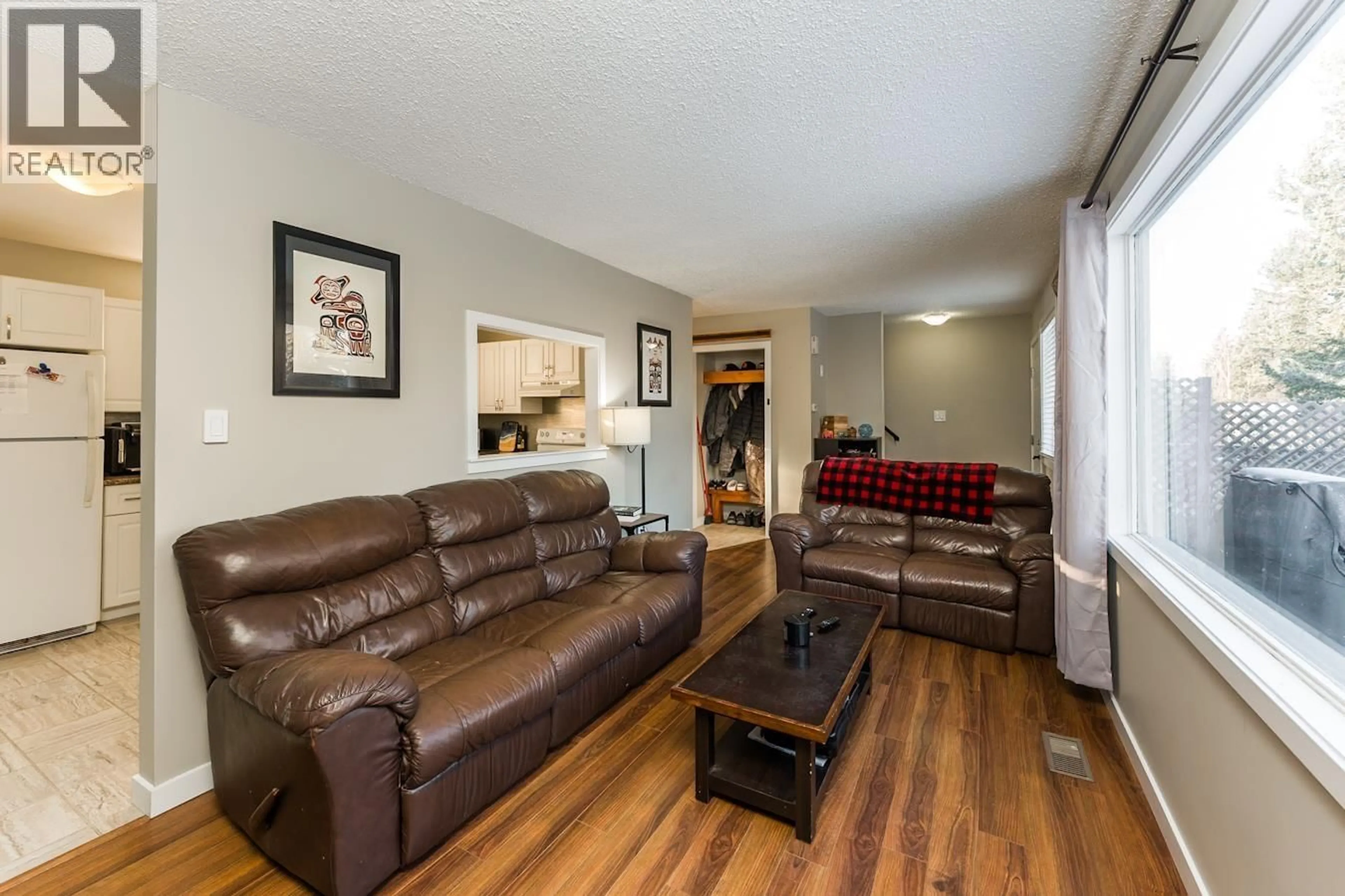 Living room with furniture, wood/laminate floor for 177 MCARTHUR PLACE, Prince George British Columbia V2M5N5