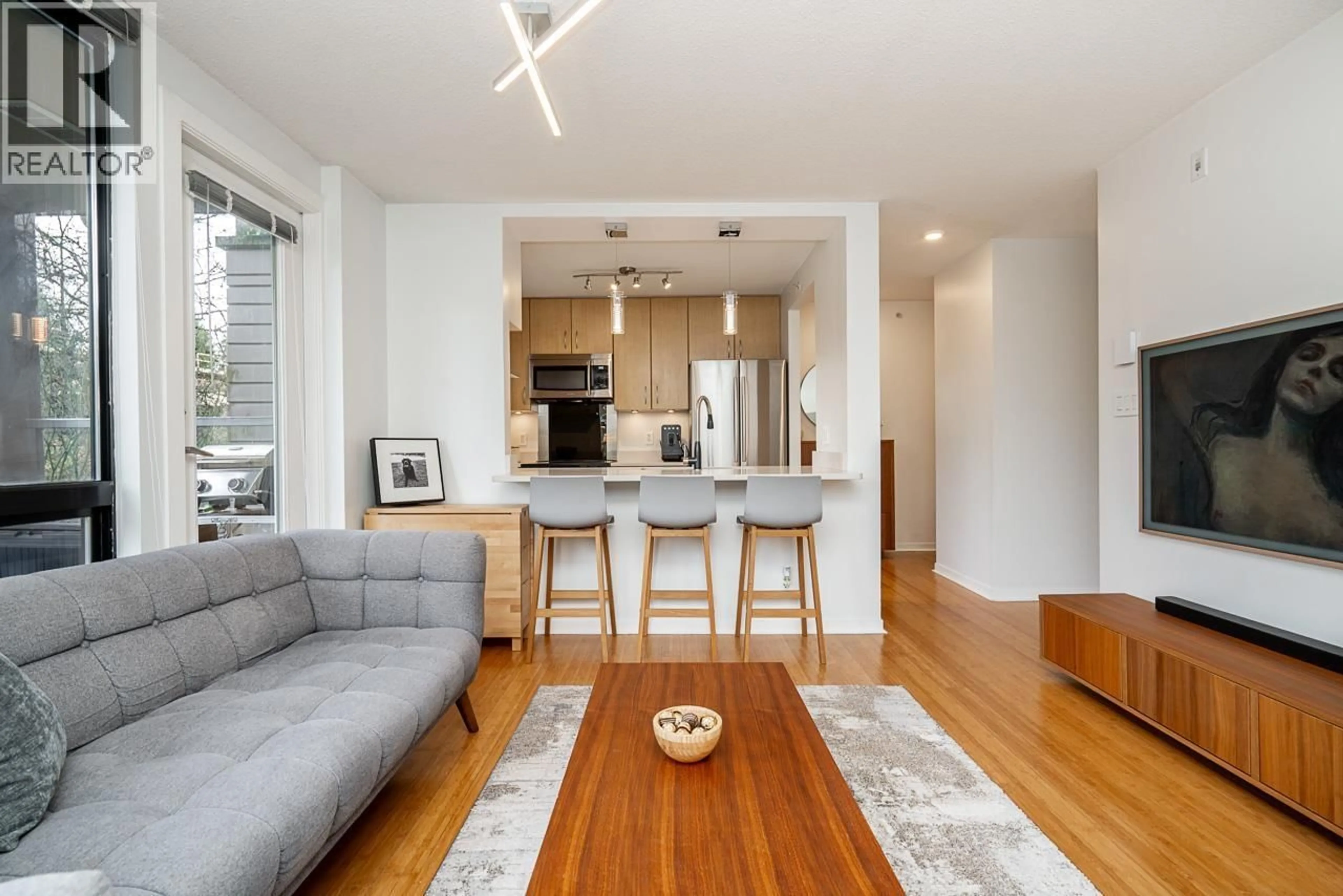 Open concept kitchen, wood/laminate floor for 206 - 3638 VANNESS AVENUE, Vancouver British Columbia V5R6H6