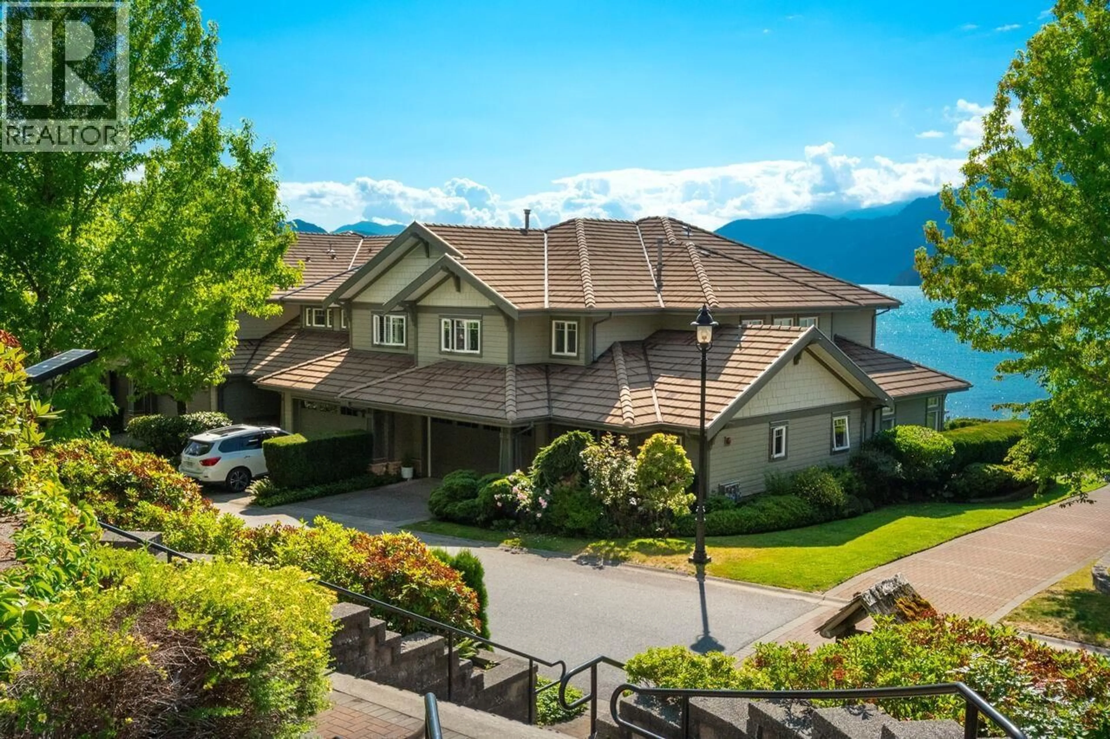A pic from outside/outdoor area/front of a property/back of a property/a pic from drone, water/lake/river/ocean view for 15 BEACH DRIVE, Furry Creek British Columbia V8B1A2