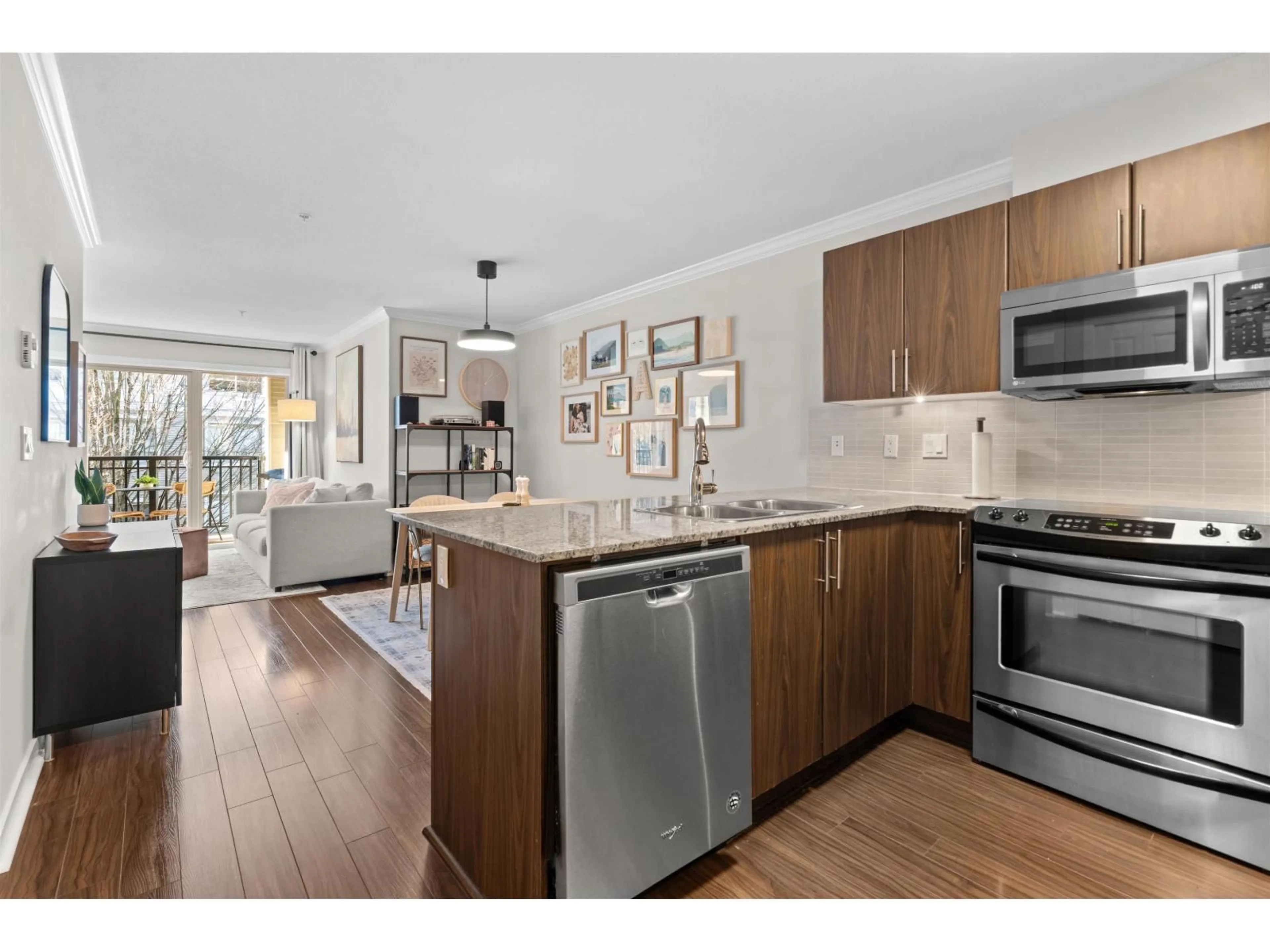 Open concept kitchen, wood/laminate floor for A302 - 8929 202 STREET, Langley British Columbia V1M0B4