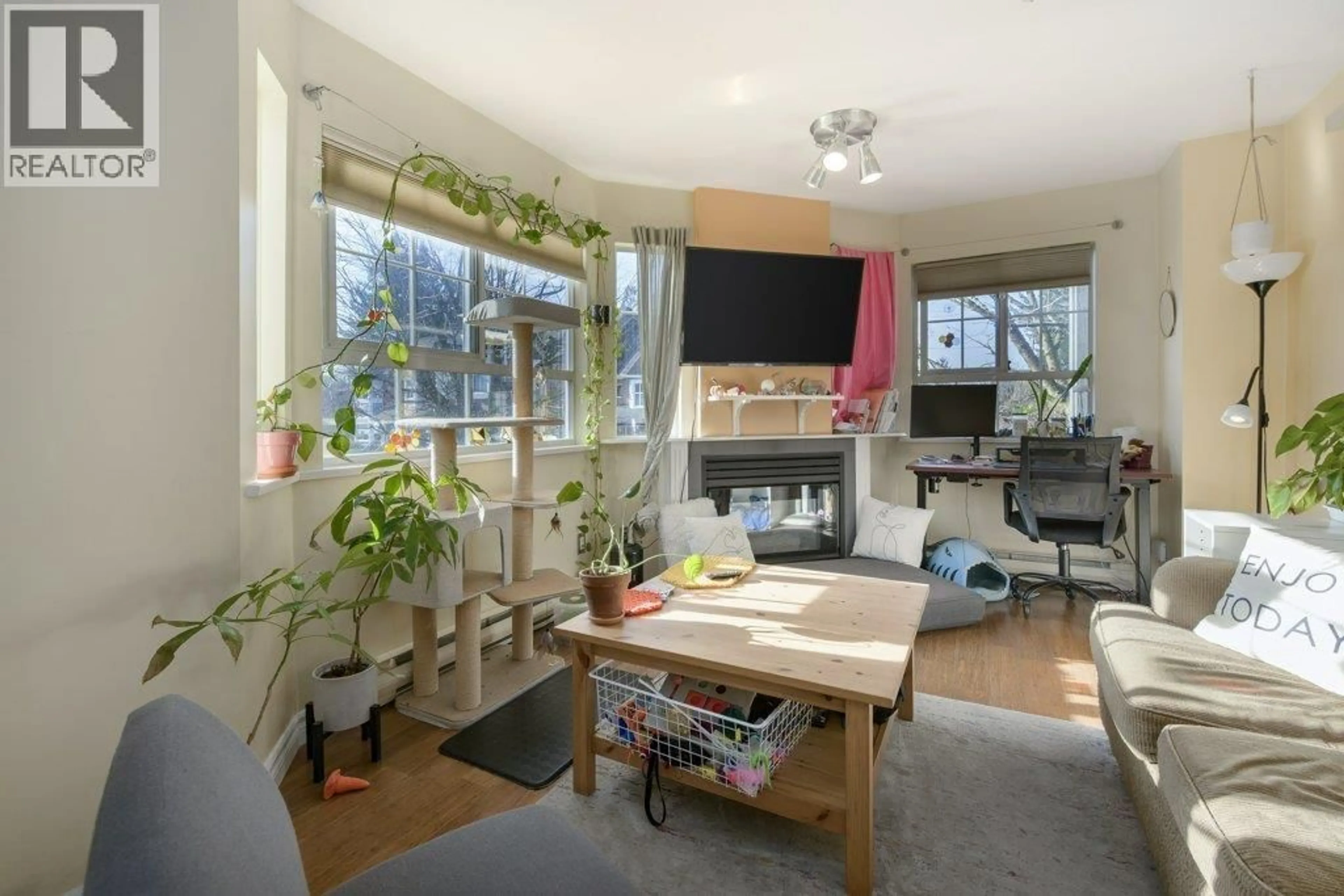 Living room with furniture, wood/laminate floor for 204 - 1520 COTTON DRIVE, Vancouver British Columbia V5L3V2