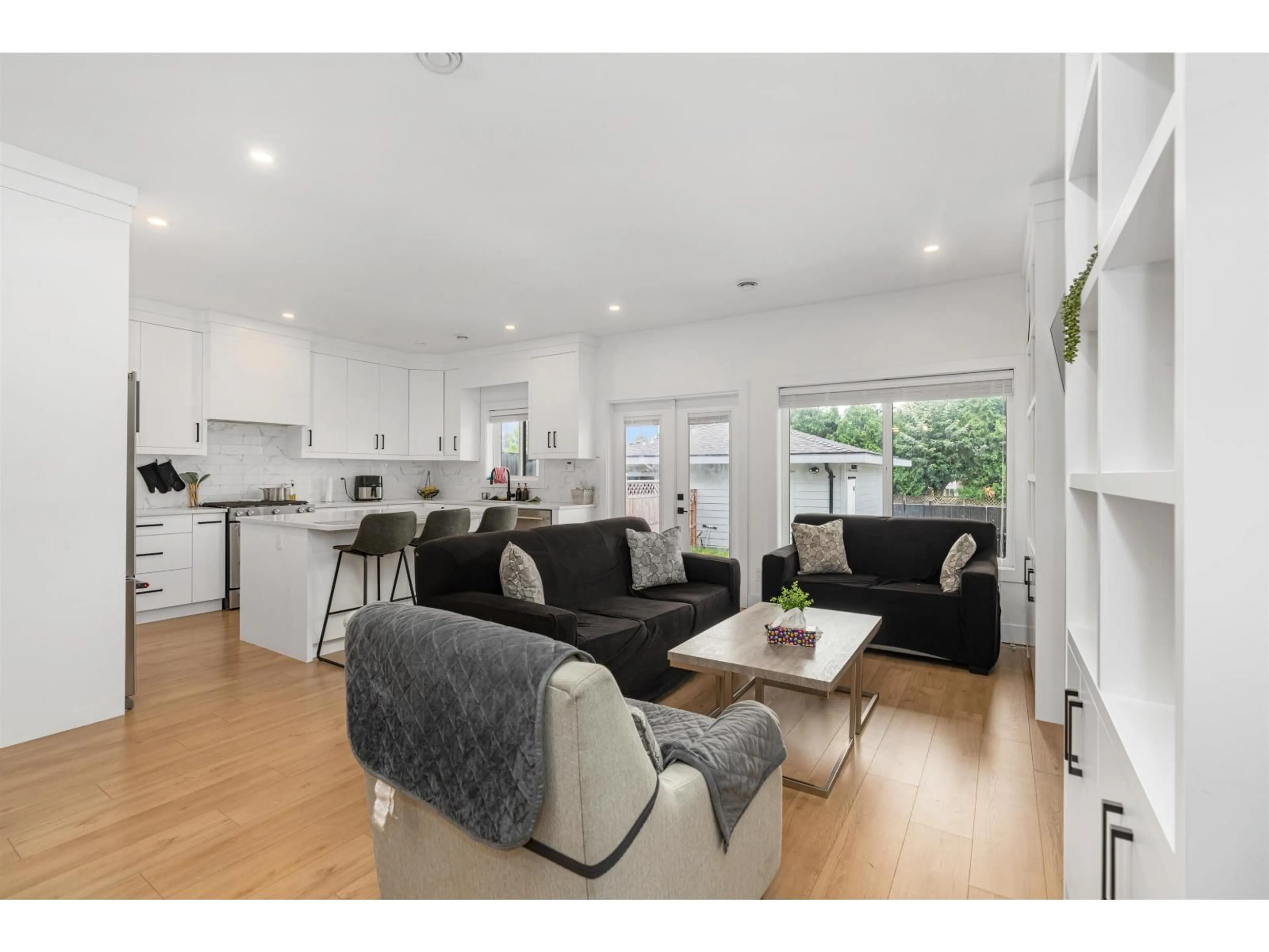 Open concept kitchen, wood/laminate floor for 18460 64 AVENUE, Surrey British Columbia V3S8J6