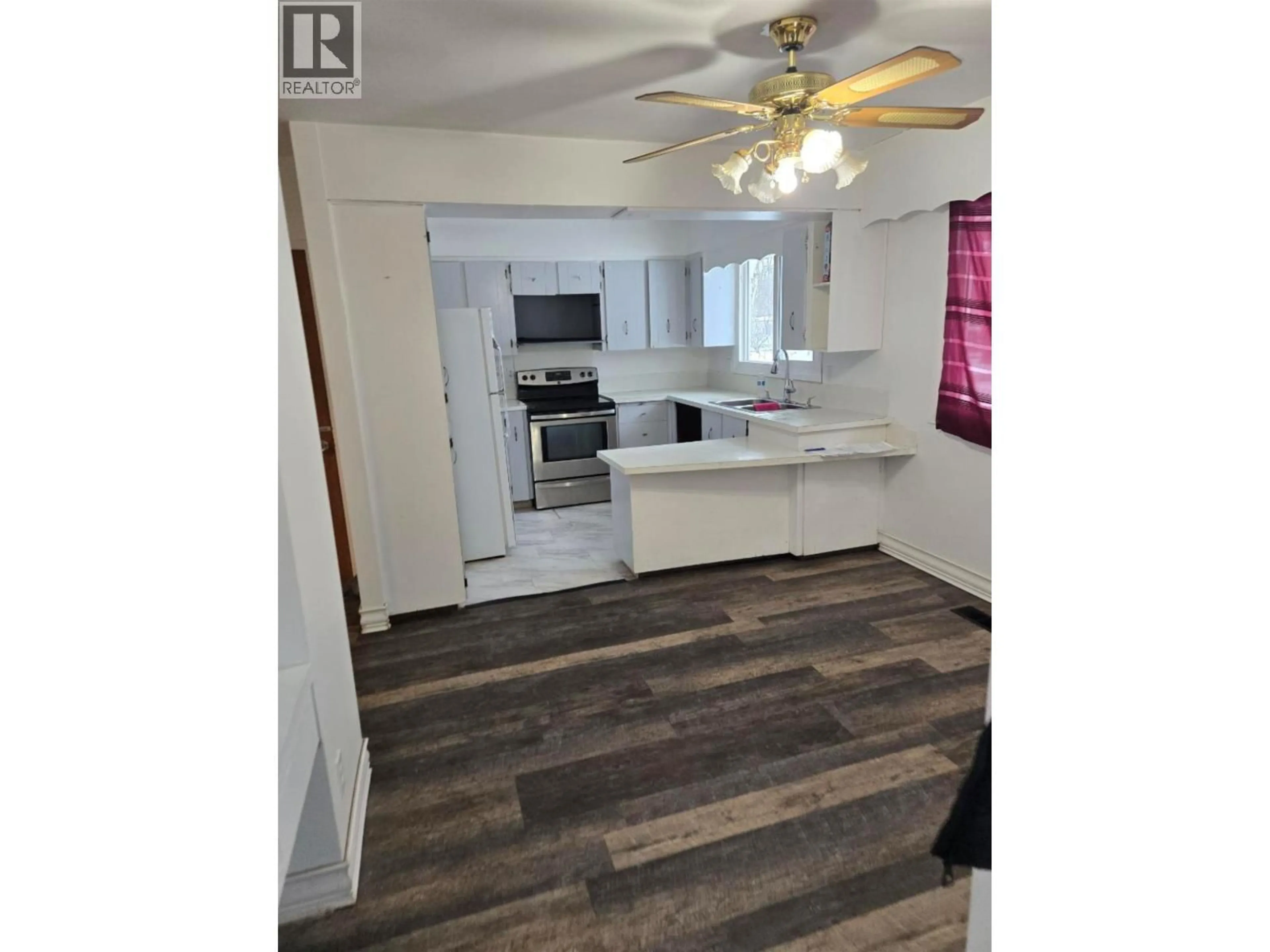Open concept kitchen, wood/laminate floor for 133 MOFFAT STREET, Prince George British Columbia V2M3L3