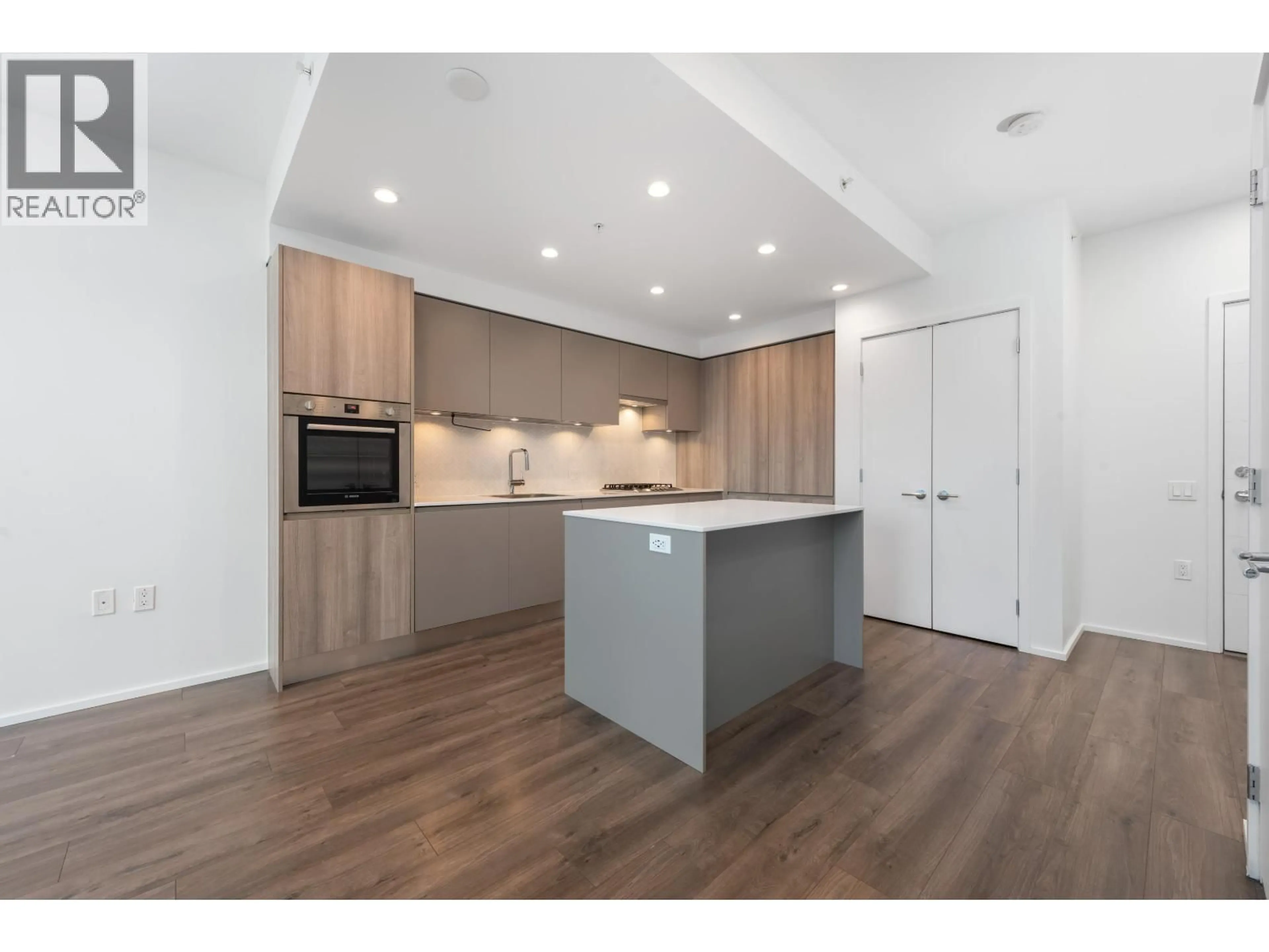 Open concept kitchen, wood/laminate floor for 1004 - 3809 EVERGREEN PLACE, Burnaby British Columbia V3J0M1