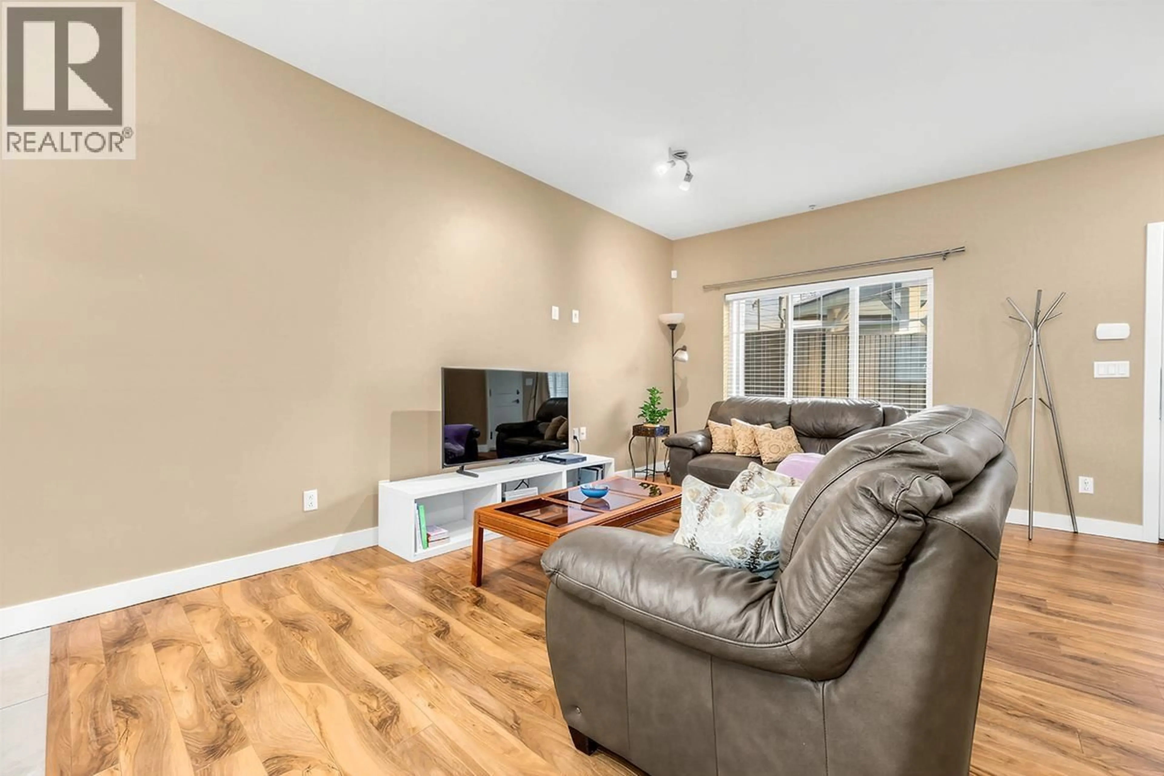 Living room with furniture, wood/laminate floor for 121 - 3888 NORFOLK STREET, Burnaby British Columbia V5G1E5