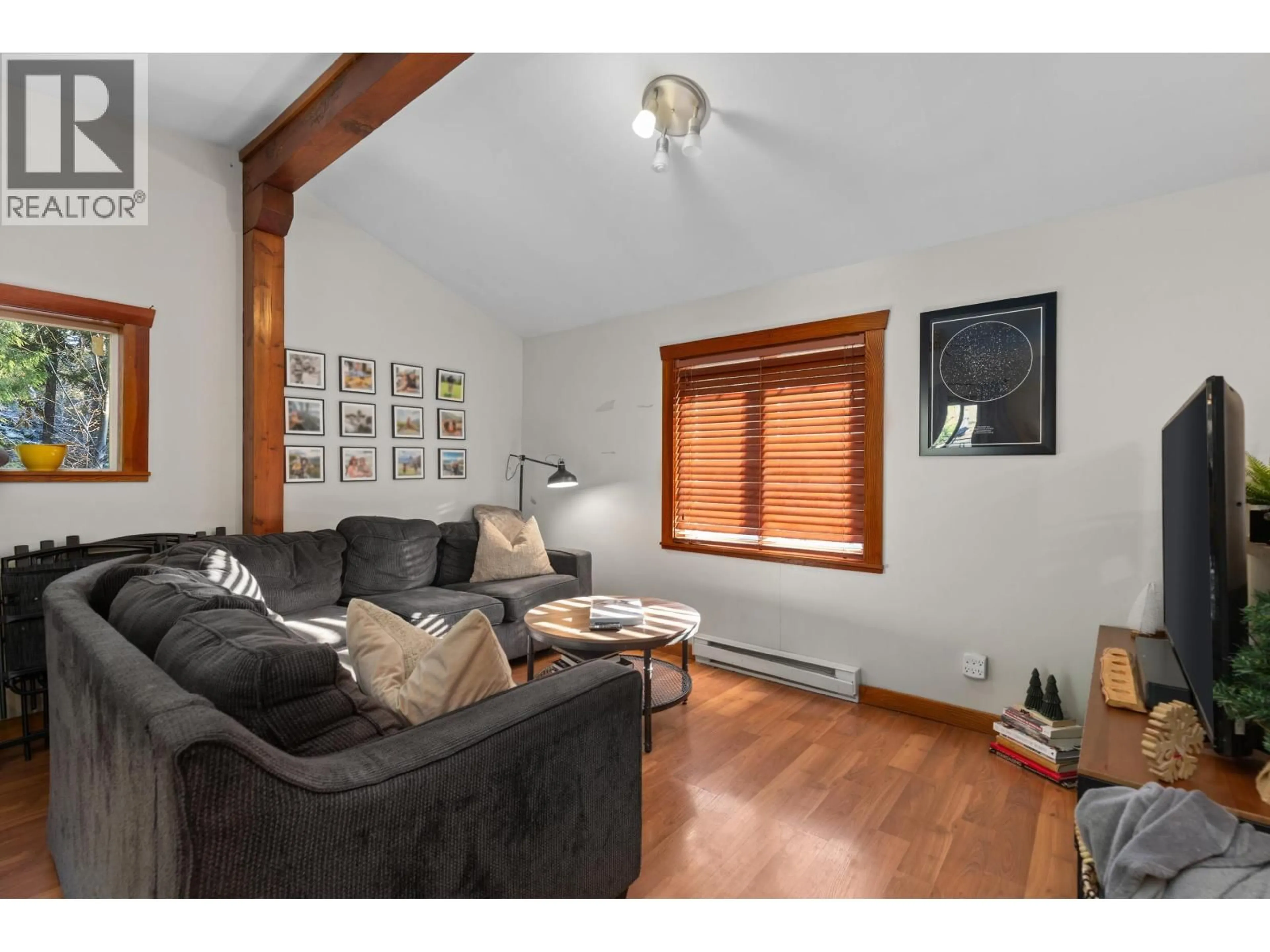 Living room with furniture, wood/laminate floor for 9245 PEMBERTON PORTAGE ROAD, D'Arcy British Columbia V0N1L0