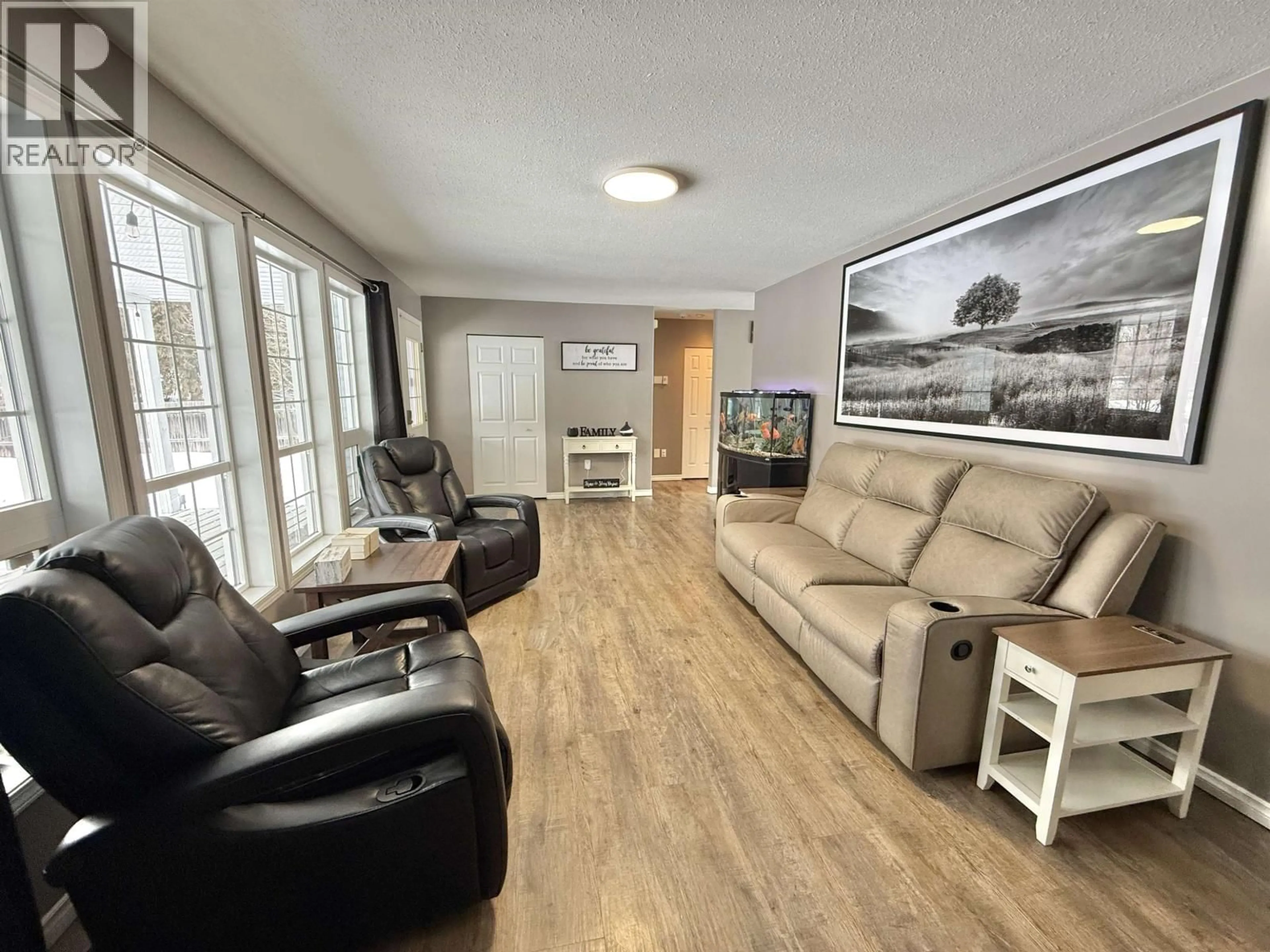 Living room with furniture, wood/laminate floor for 950 LAUREL ROAD, Quesnel British Columbia V2J5V4