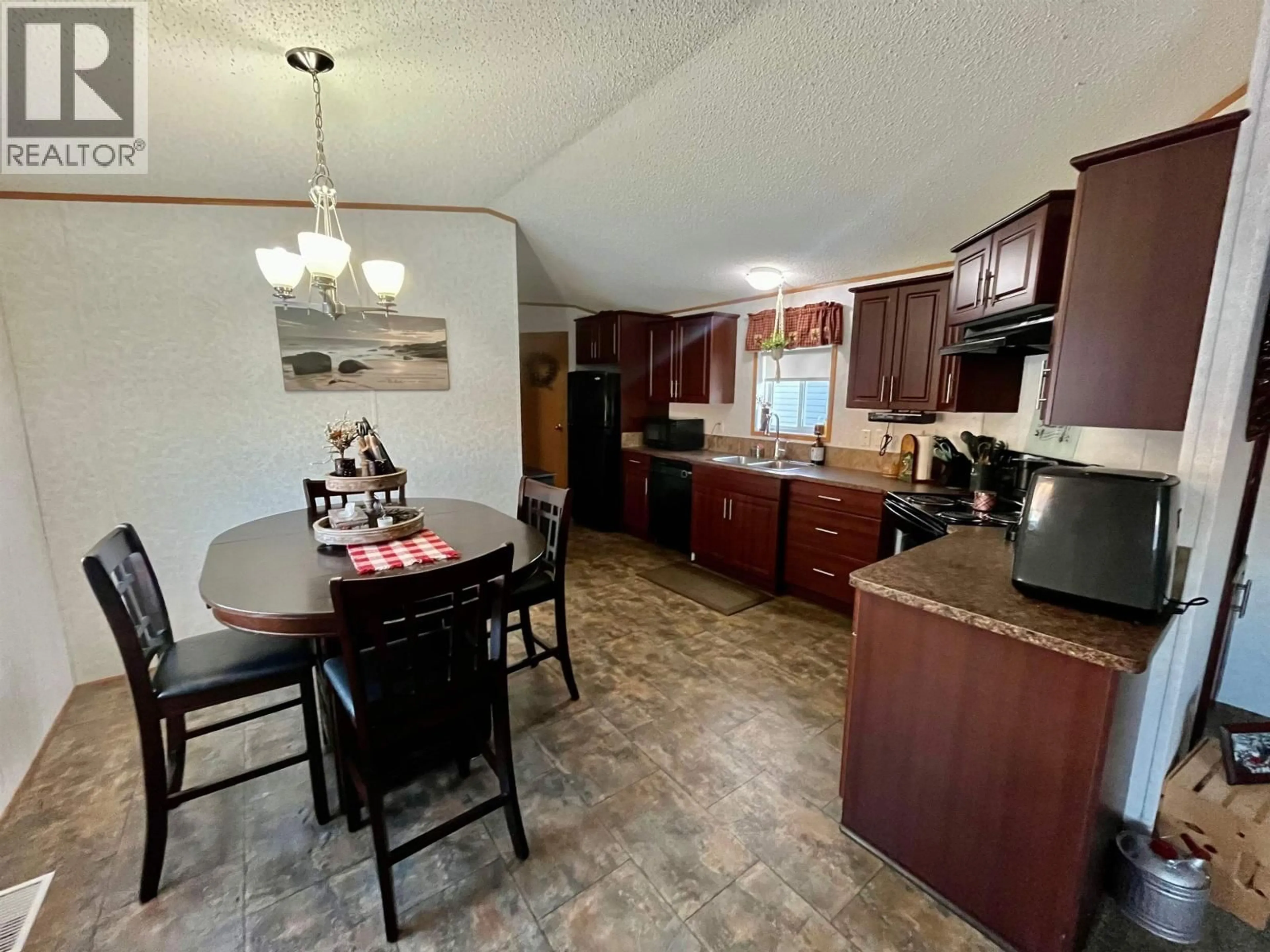 Open concept kitchen, unknown for 8112 85A AVENUE, Fort St. John British Columbia V1J0H7