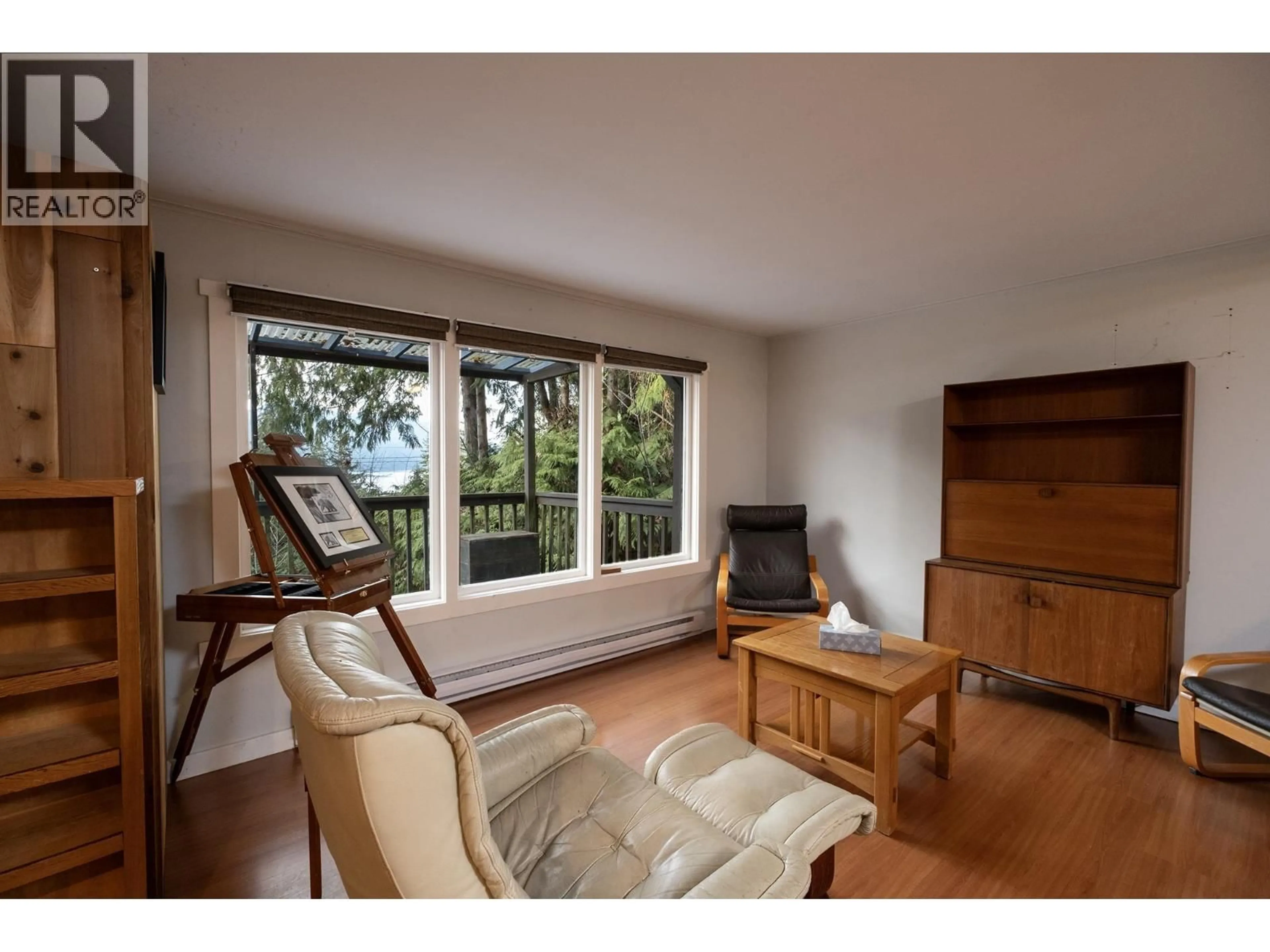 Living room with furniture, wood/laminate floor for 5863 SANDY HOOK ROAD, Sechelt British Columbia V7Z0C8