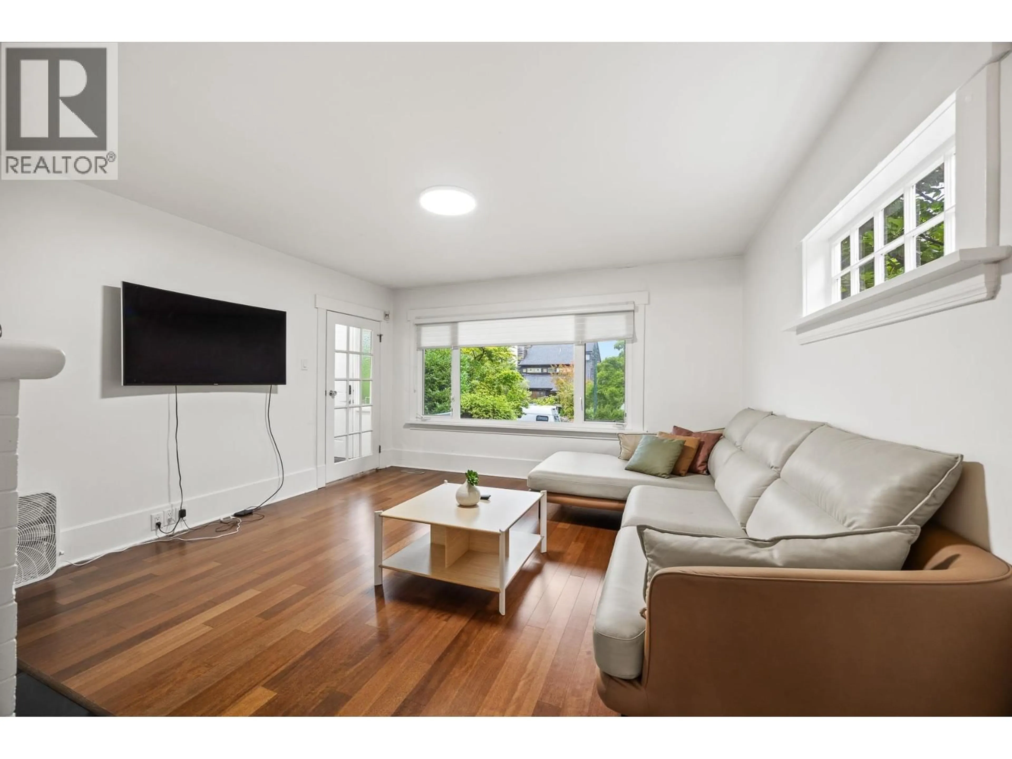 Living room with furniture, wood/laminate floor for 3276 21ST AVENUE, Vancouver British Columbia V6L1L2