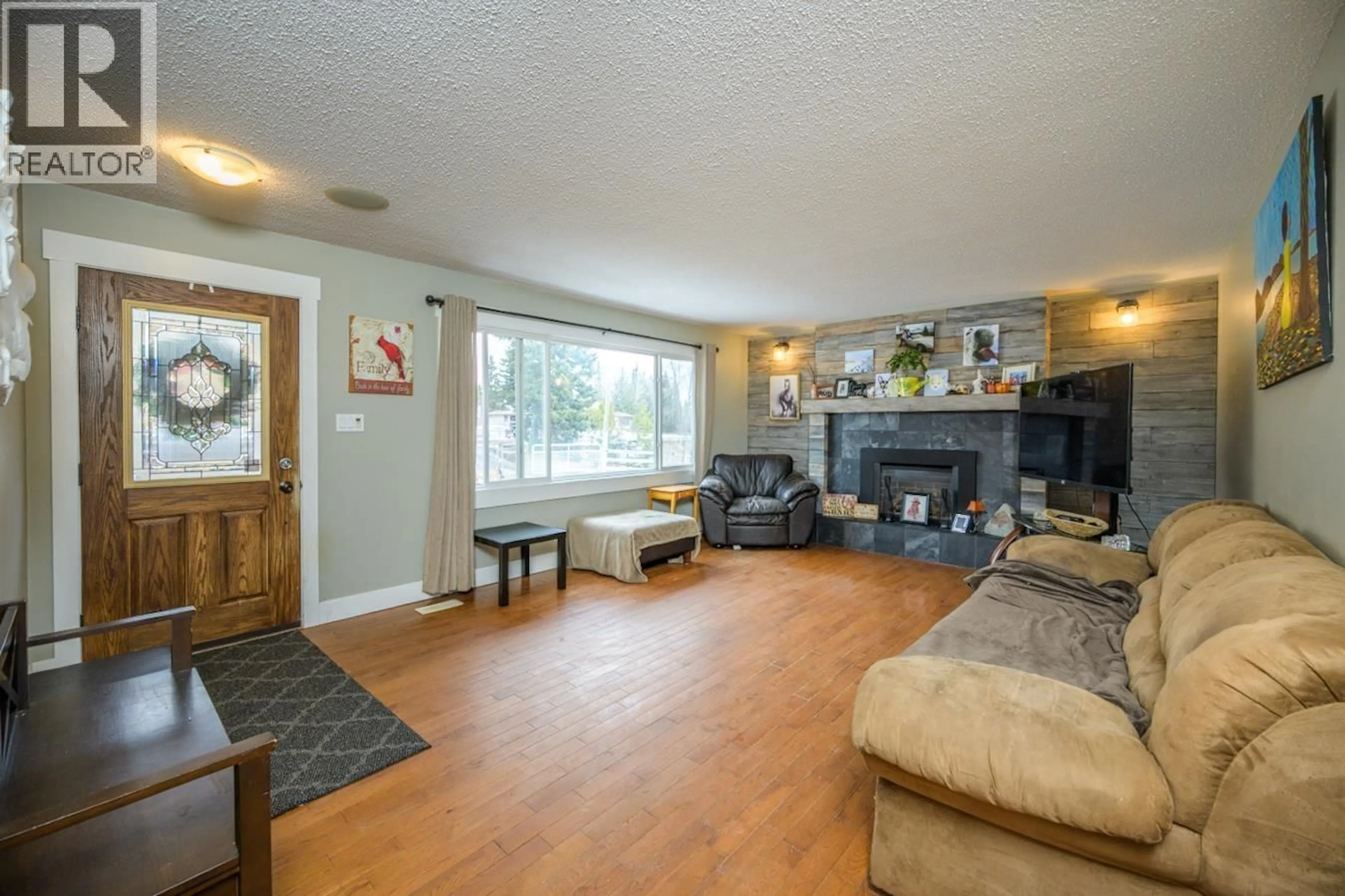 Living room with furniture, wood/laminate floor for 5503 CRANBROOK HILL ROAD, Prince George British Columbia V2M7C8