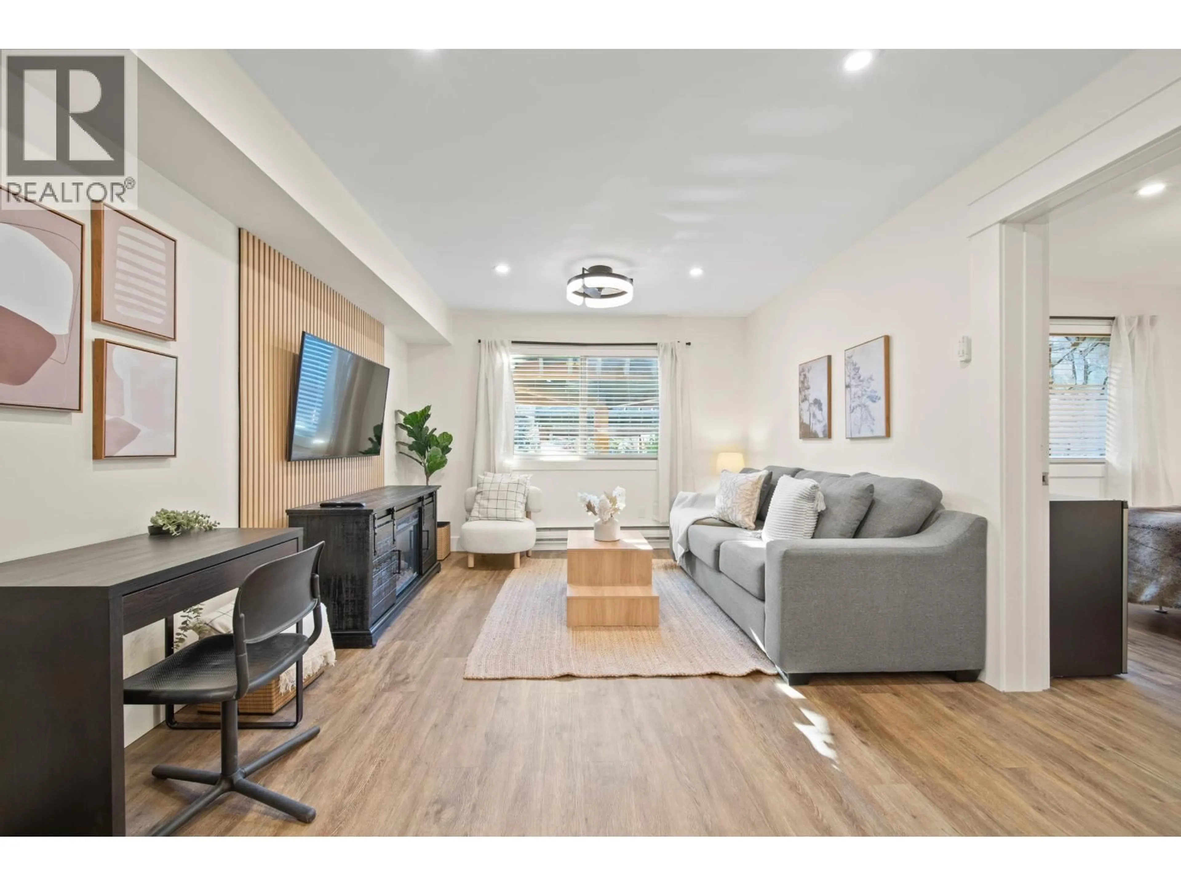 Living room with furniture, wood/laminate floor for 101 - 2021 KAREN CRESCENT, Whistler British Columbia V8E0H1