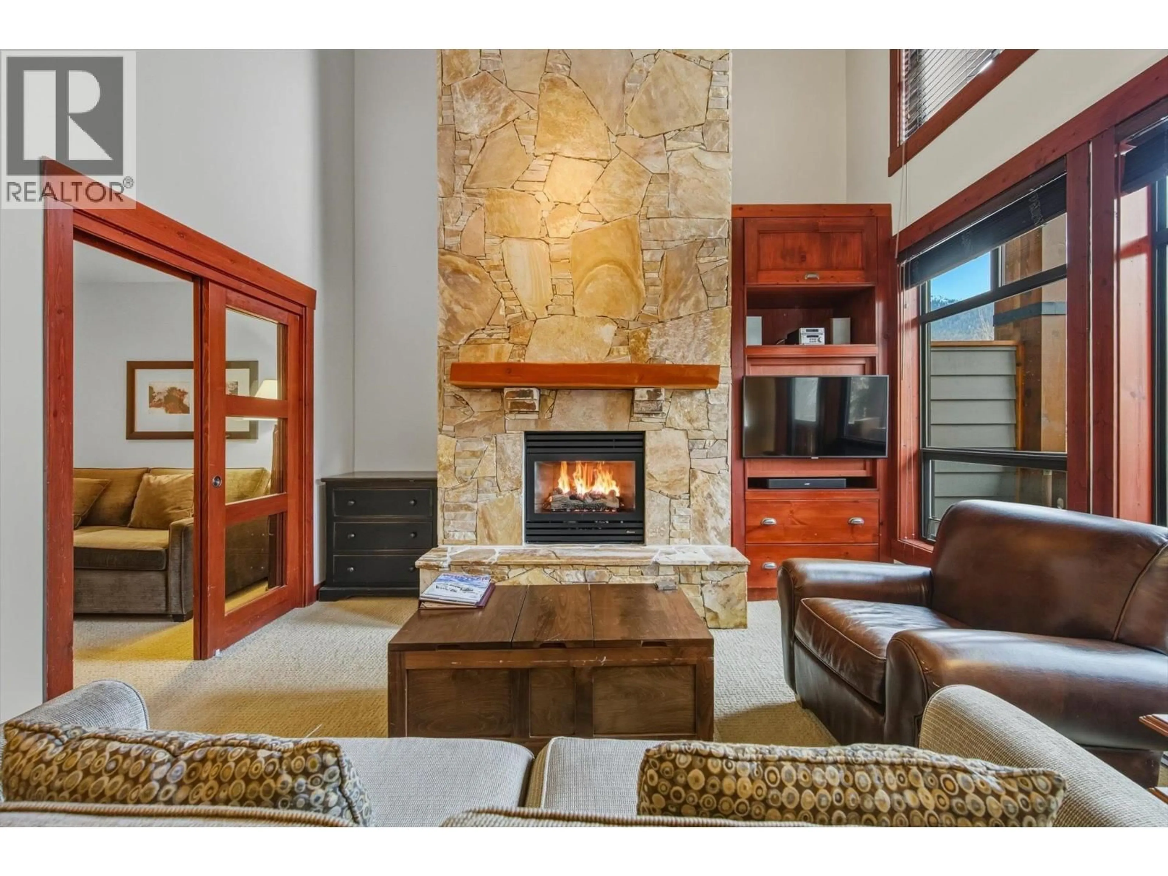 Living room with furniture, ceramic/tile floor for 208 - 2202 GONDOLA WAY WAY, Whistler British Columbia V8E0M7