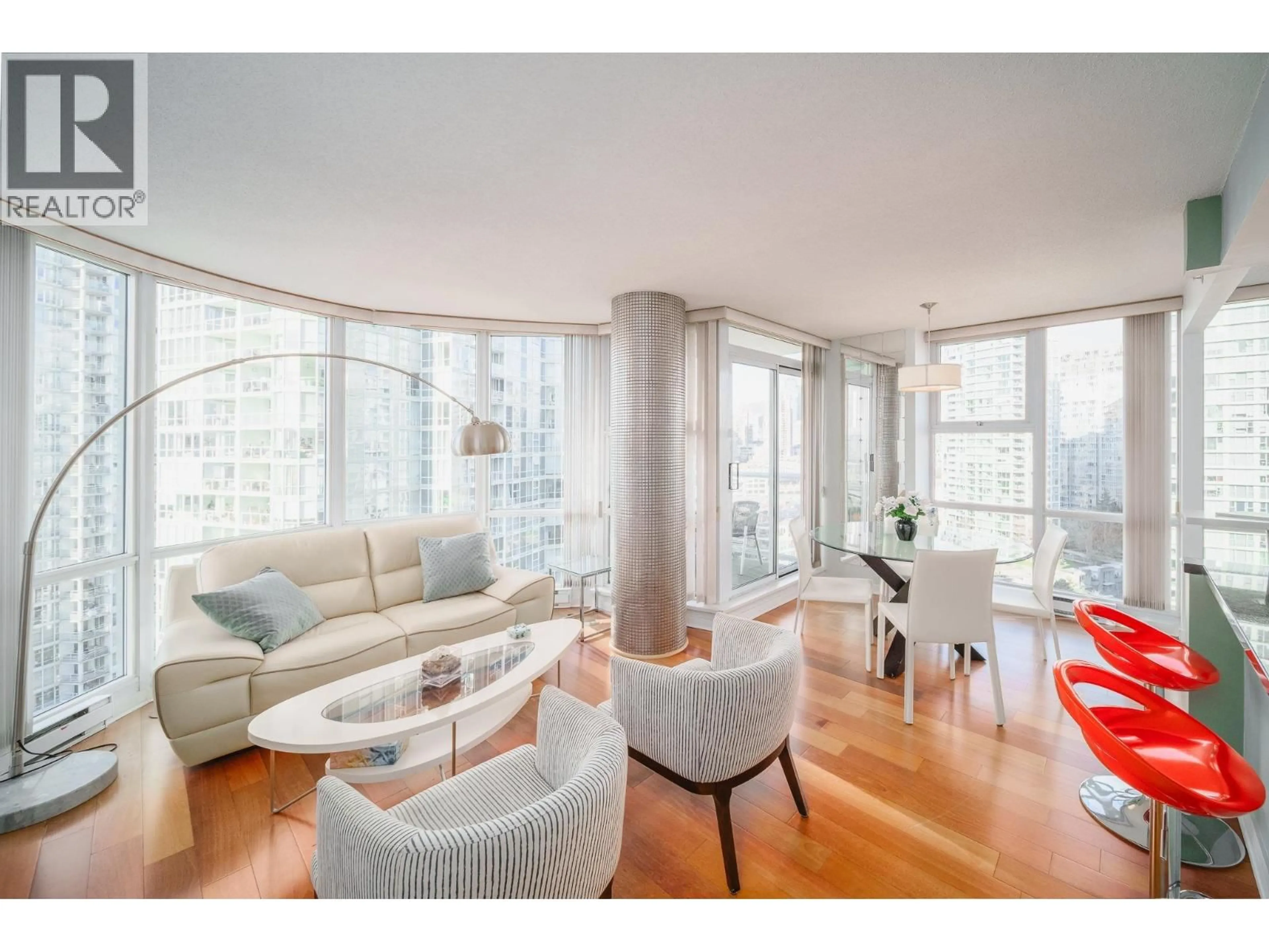 Living room with furniture, wood/laminate floor for 1906 - 1077 MARINASIDE CRESCENT, Vancouver British Columbia V6Z2Z5
