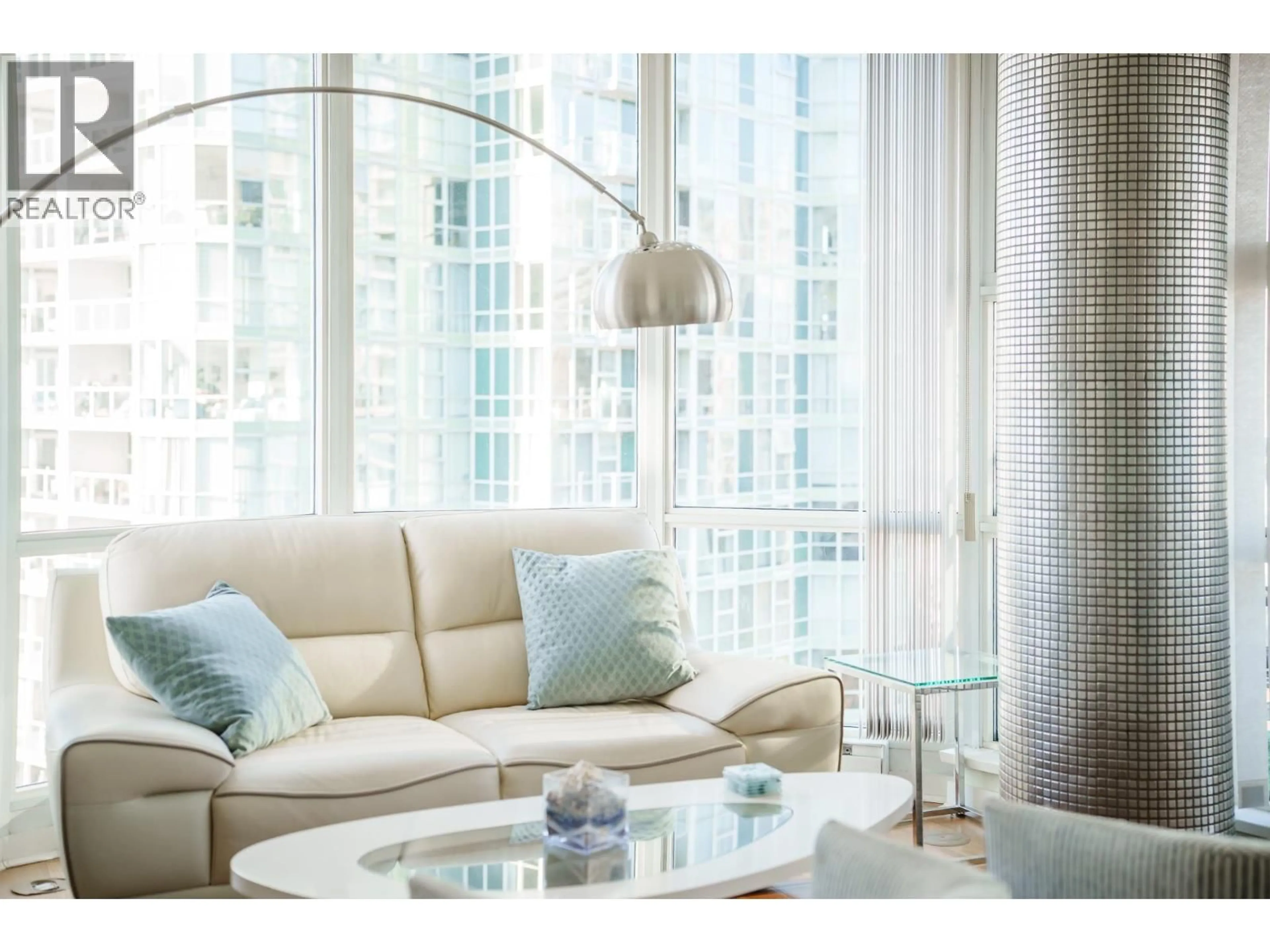 Living room with furniture, wood/laminate floor for 1906 - 1077 MARINASIDE CRESCENT, Vancouver British Columbia V6Z2Z5