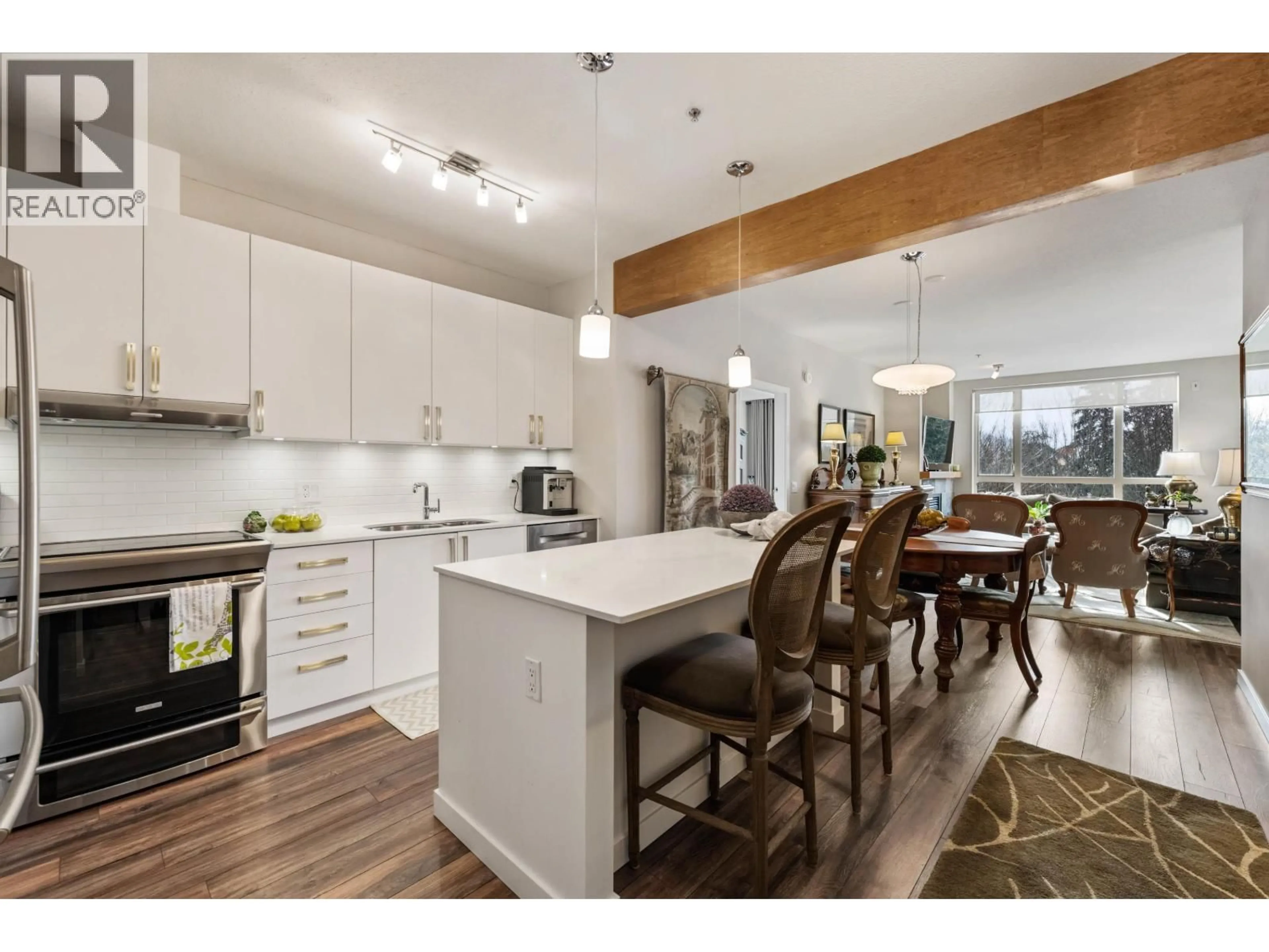 Open concept kitchen, wood/laminate floor for 209 - 560 RAVENWOODS DRIVE, North Vancouver British Columbia V7G2T3