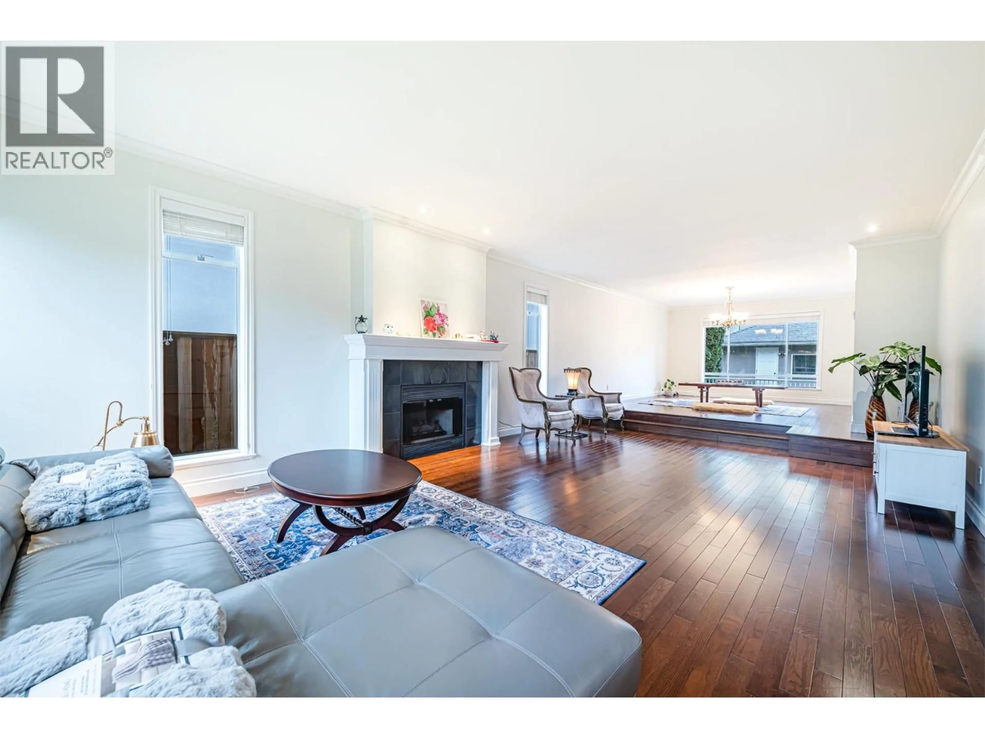 Living room with furniture, wood/laminate floor for 4570 13TH AVENUE, Vancouver British Columbia V6R2V4