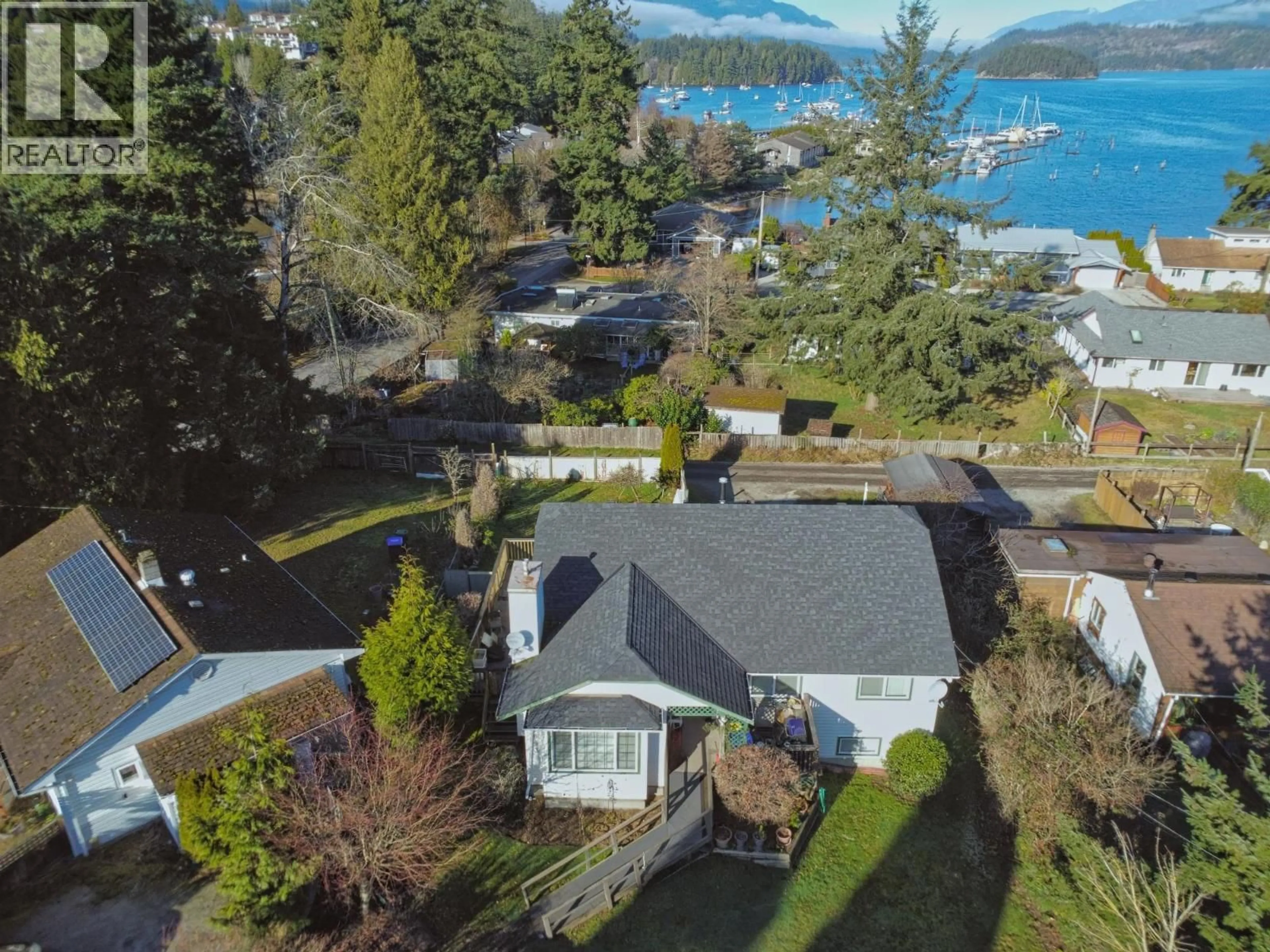 A pic from outside/outdoor area/front of a property/back of a property/a pic from drone, water/lake/river/ocean view for 5693 PORPOISE BAY ROAD, Sechelt British Columbia V0N3A4