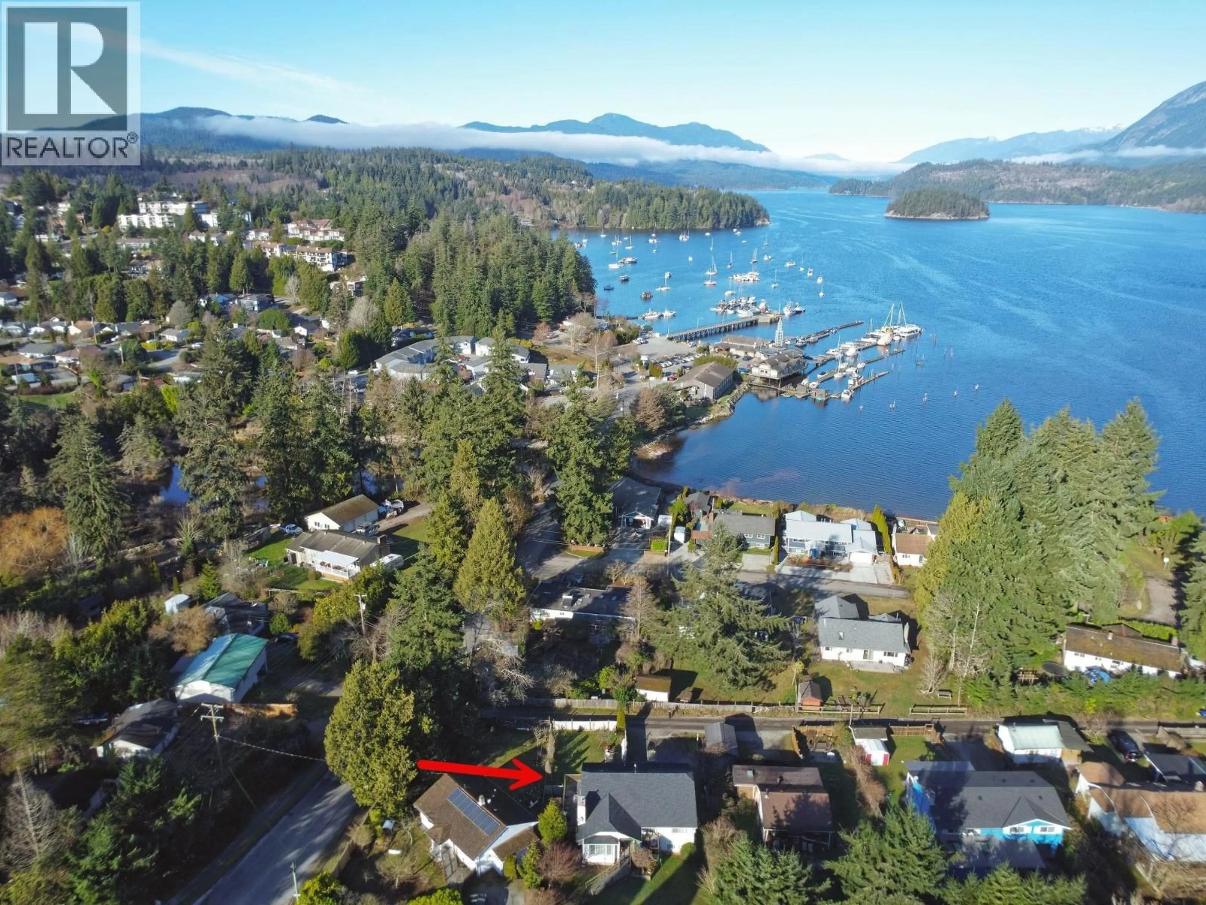 A pic from outside/outdoor area/front of a property/back of a property/a pic from drone, water/lake/river/ocean view for 5693 PORPOISE BAY ROAD, Sechelt British Columbia V0N3A4
