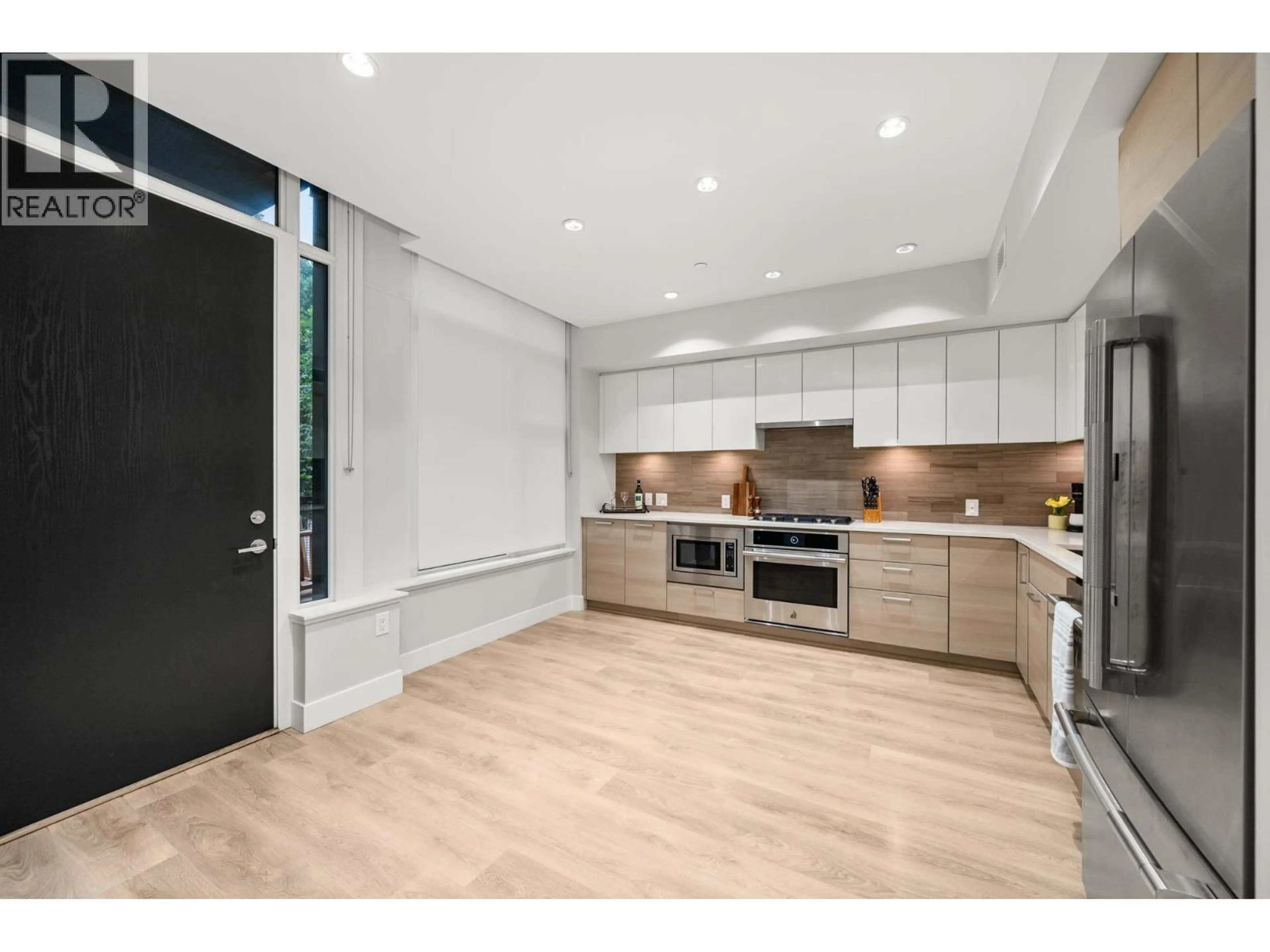 Open concept kitchen, wood/laminate floor for 3482 MARINE WAY, Vancouver British Columbia V5S0H1