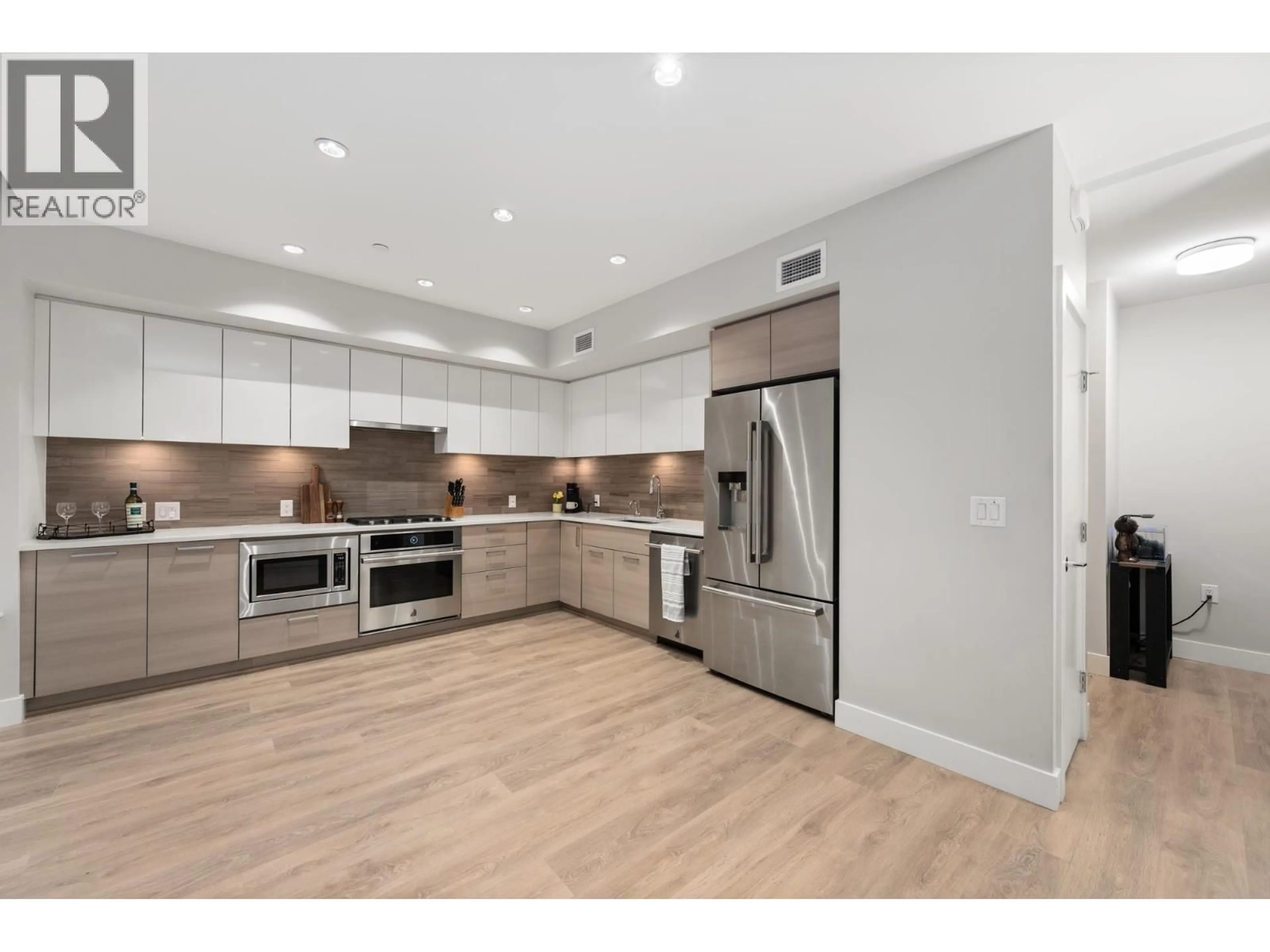 Open concept kitchen, wood/laminate floor for 3482 MARINE WAY, Vancouver British Columbia V5S0H1