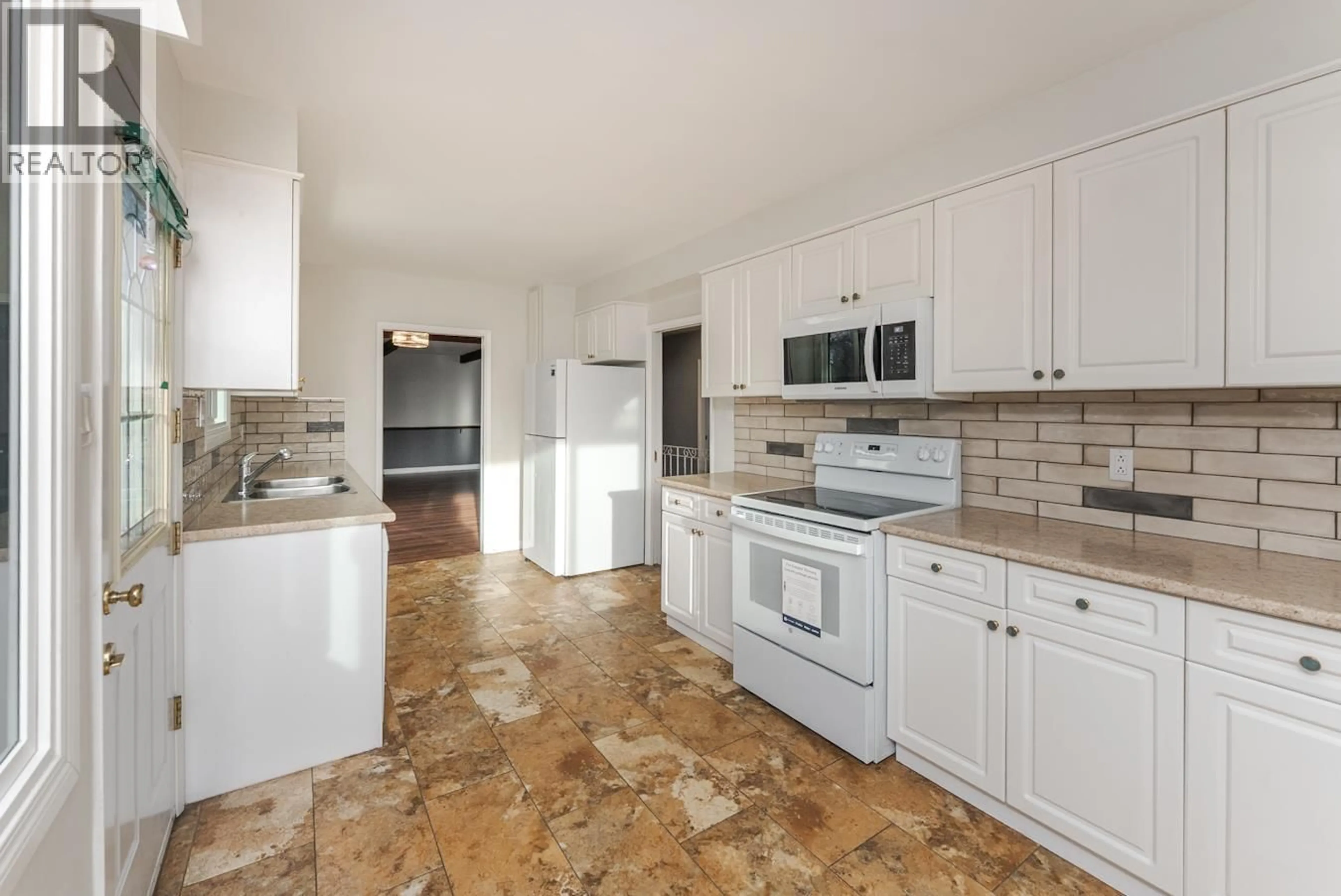 Open concept kitchen, ceramic/tile floor for 2425 EWERT CRESCENT, Prince George British Columbia V2M2S1