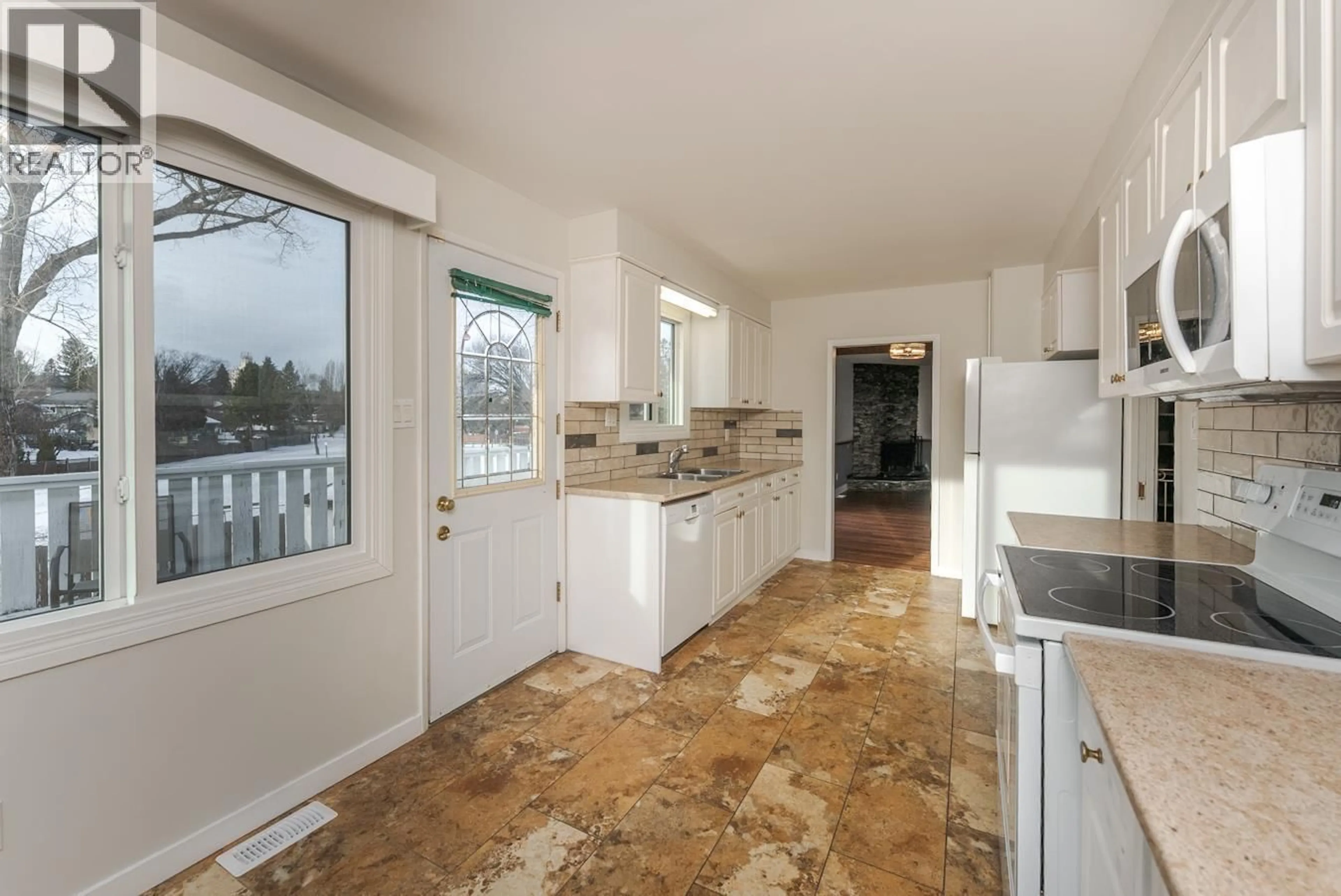 Open concept kitchen, ceramic/tile floor for 2425 EWERT CRESCENT, Prince George British Columbia V2M2S1
