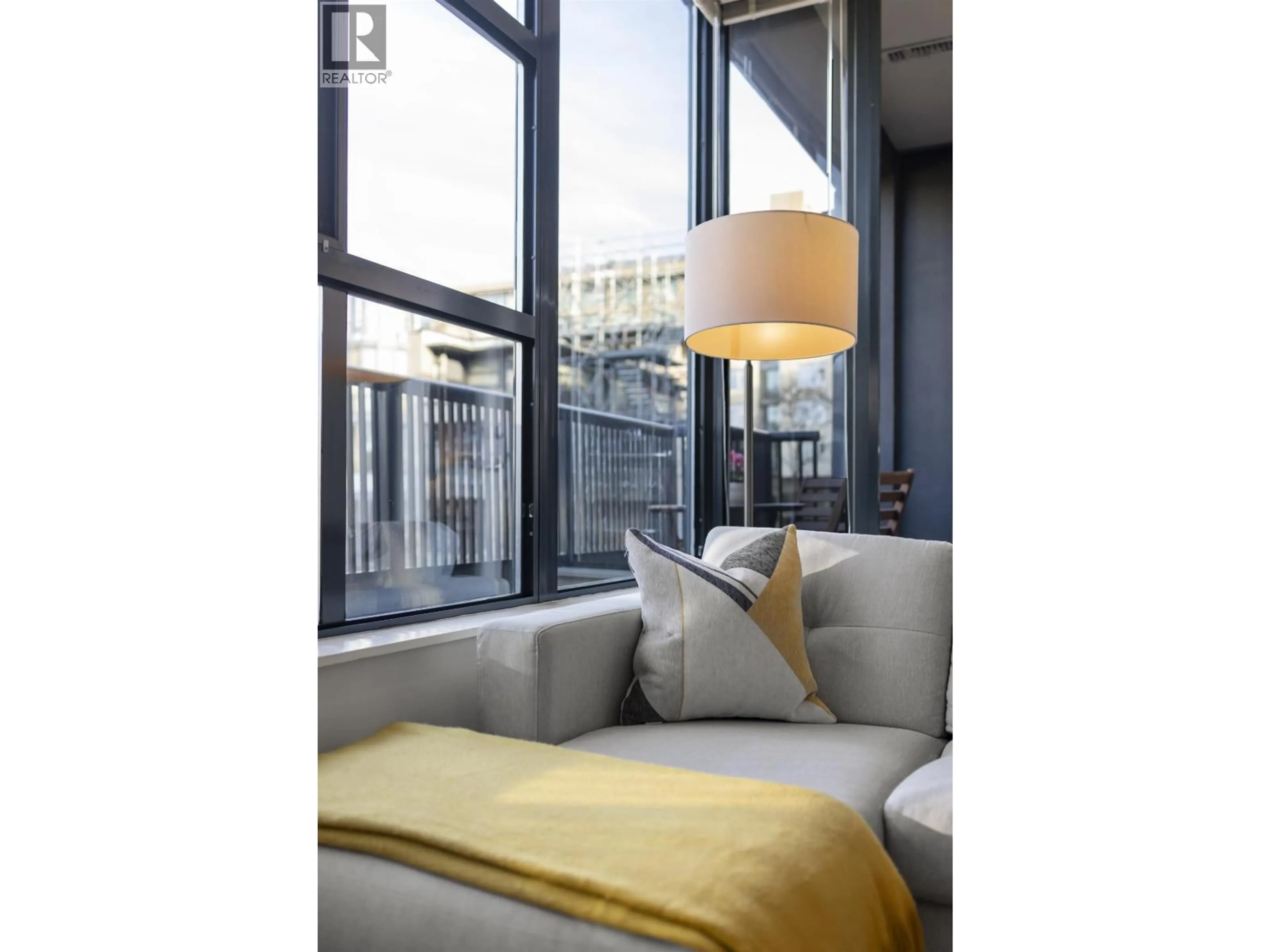 Living room with furniture, cement floor for 314 - 2268 REDBUD LANE, Vancouver British Columbia V6K4S6