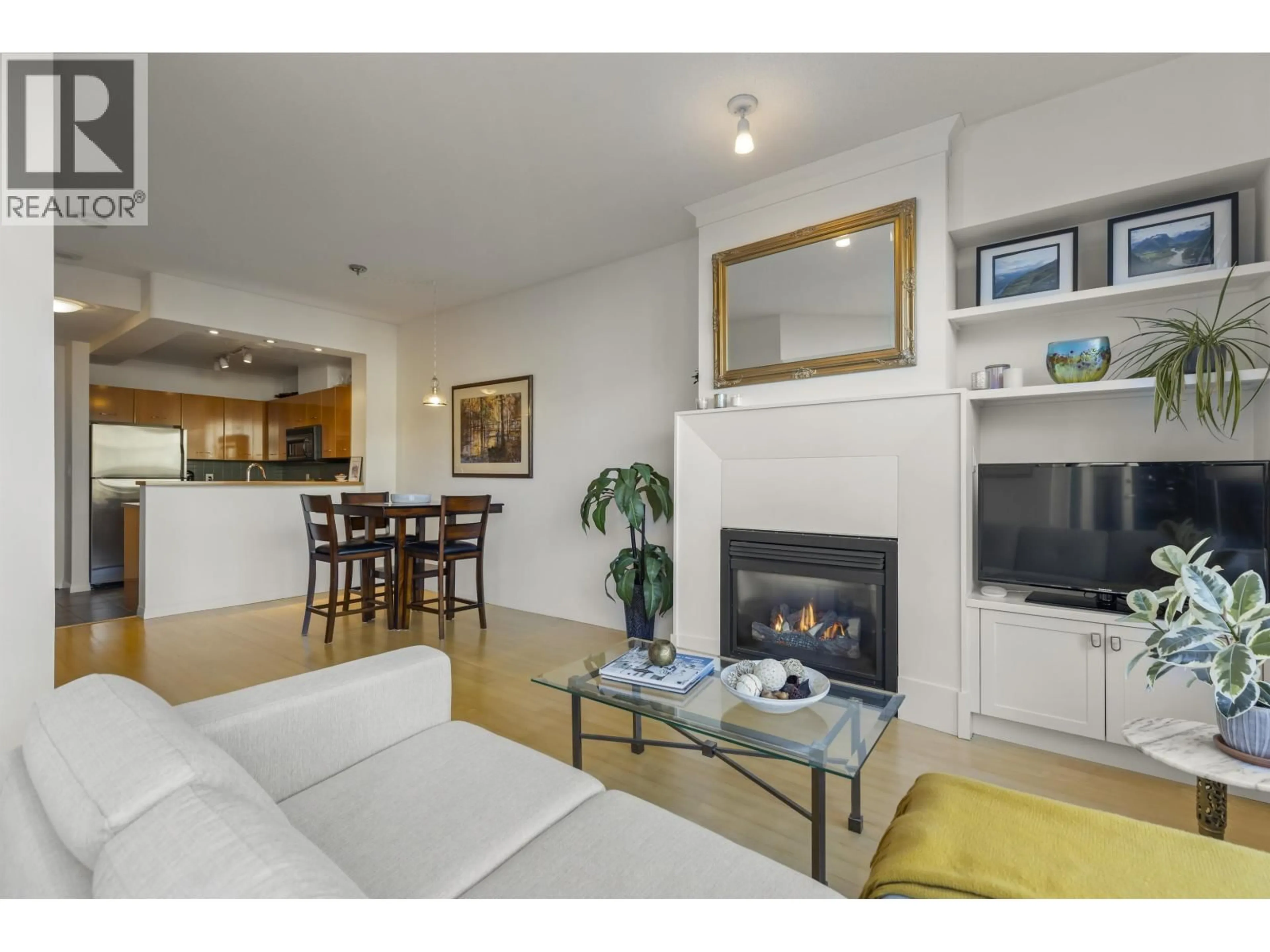 Living room with furniture, wood/laminate floor for 314 - 2268 REDBUD LANE, Vancouver British Columbia V6K4S6