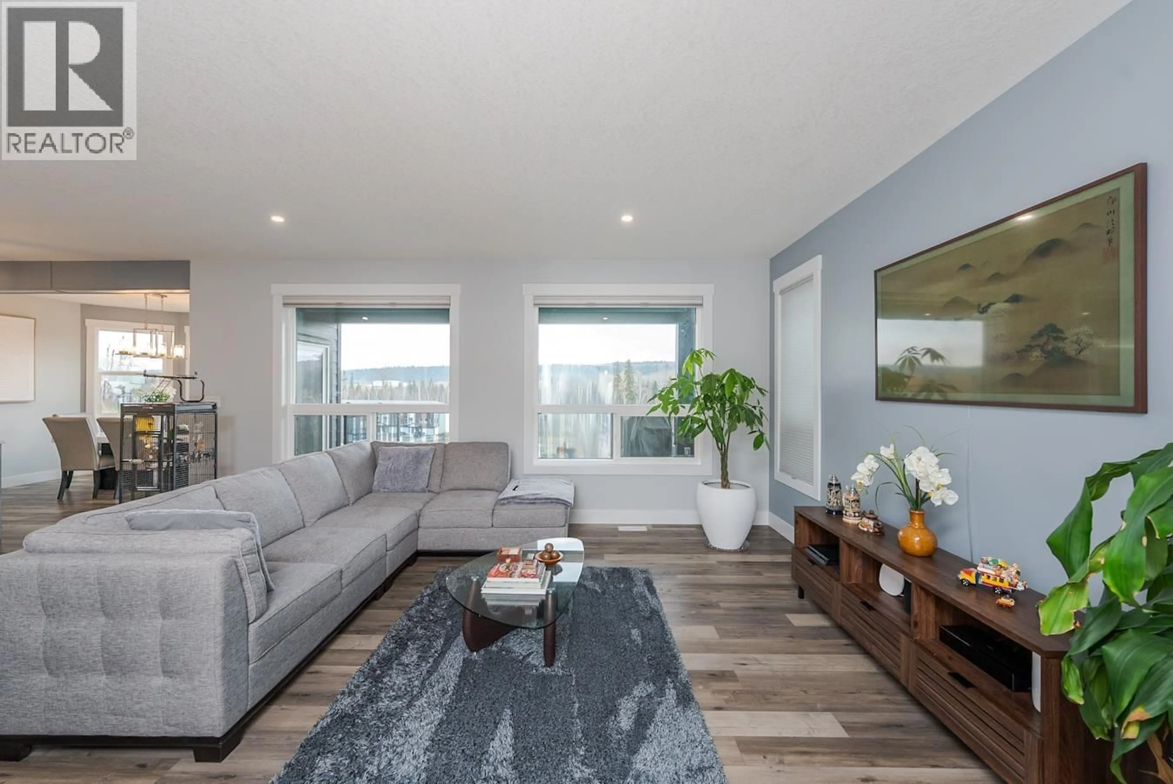 Living room with furniture, wood/laminate floor for 7204 FOXRIDGE DRIVE, Prince George British Columbia V2N0H2