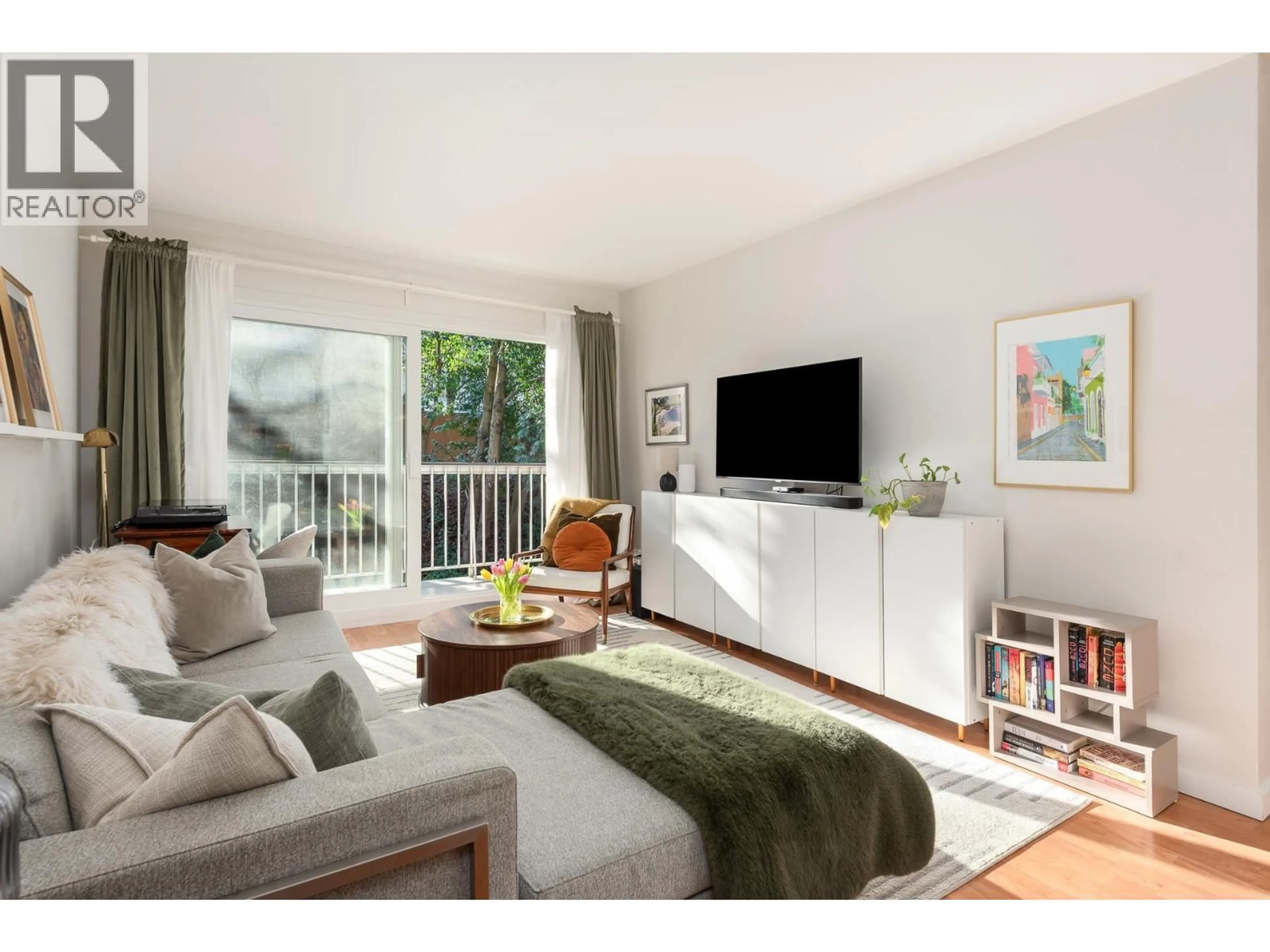 Living room with furniture, wood/laminate floor for 809 - 756 GREAT NORTHERN WAY, Vancouver British Columbia V5T1E4