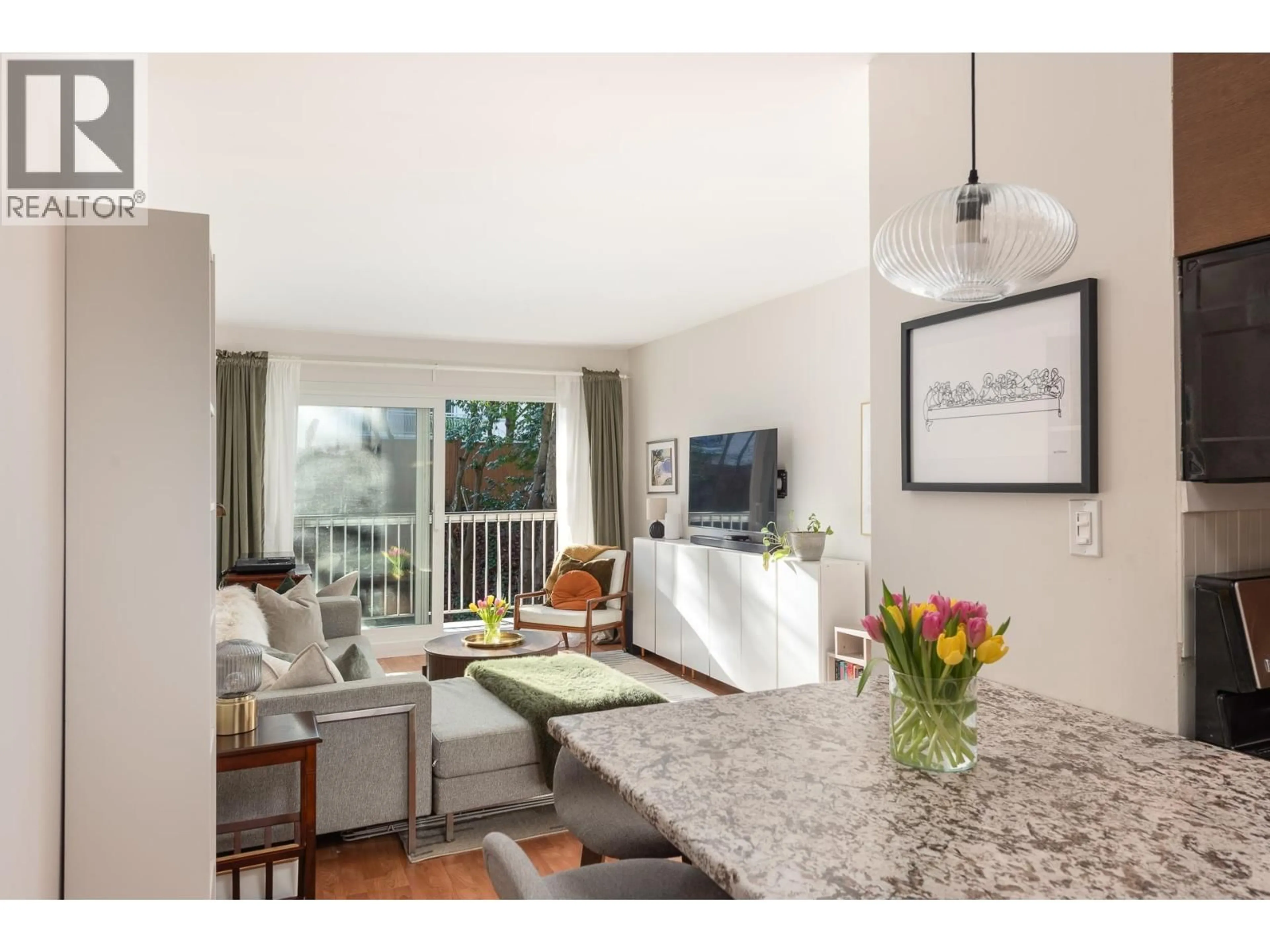 Open concept kitchen, wood/laminate floor for 809 - 756 GREAT NORTHERN WAY, Vancouver British Columbia V5T1E4