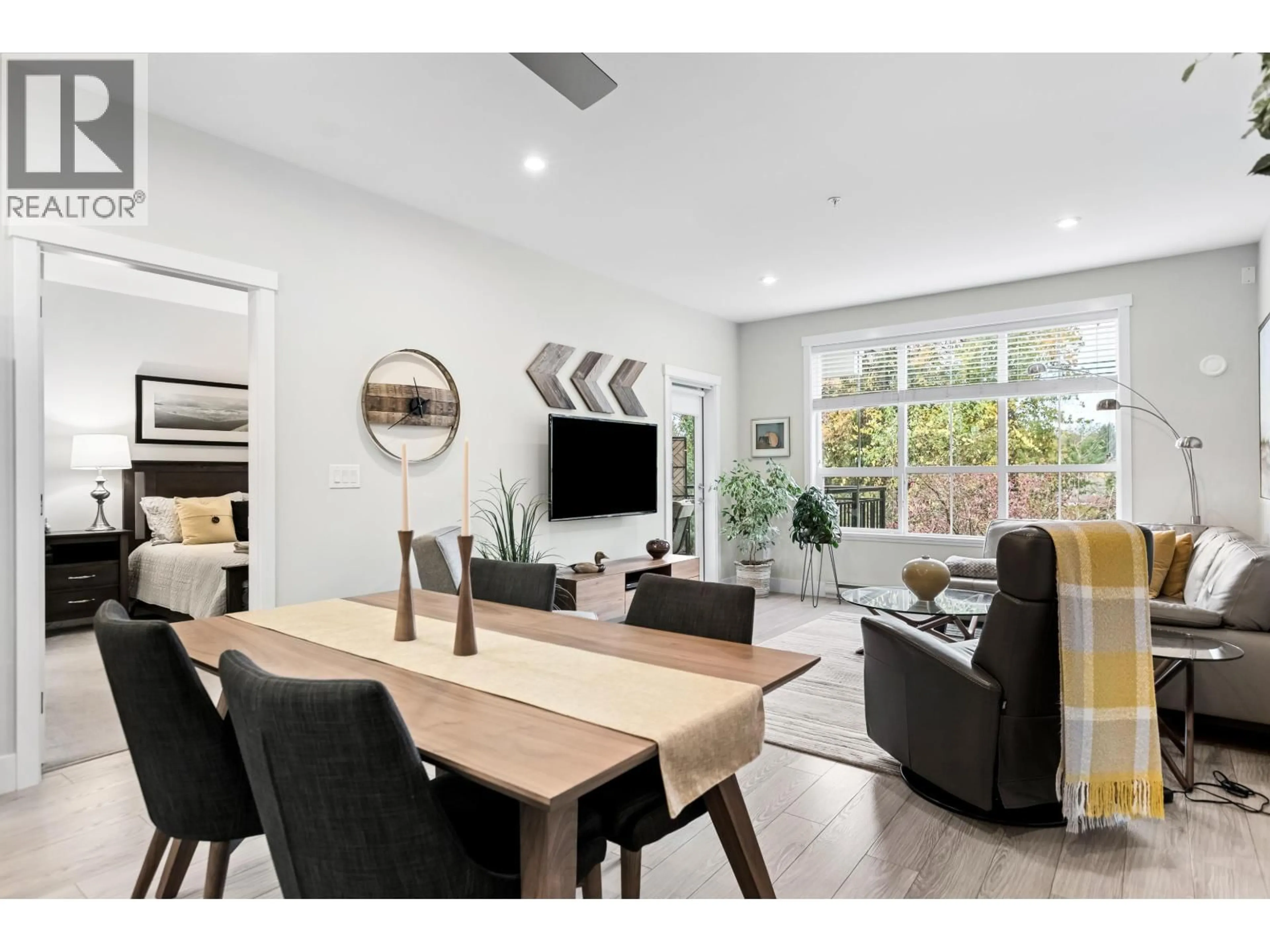 Living room with furniture, wood/laminate floor for 206 - 12367 224 STREET, Maple Ridge British Columbia V2X6B9