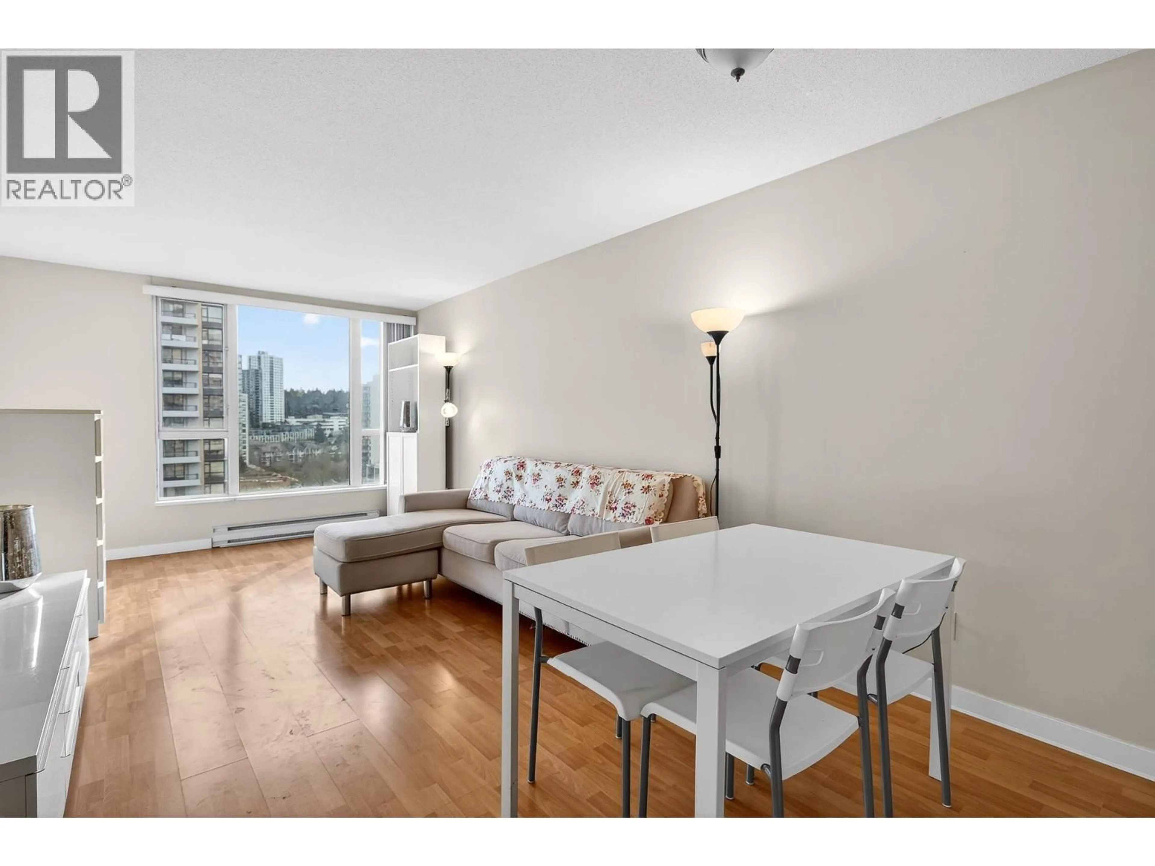 Living room with furniture, unknown for 1201 - 5189 GASTON STREET, Vancouver British Columbia V5R6C7