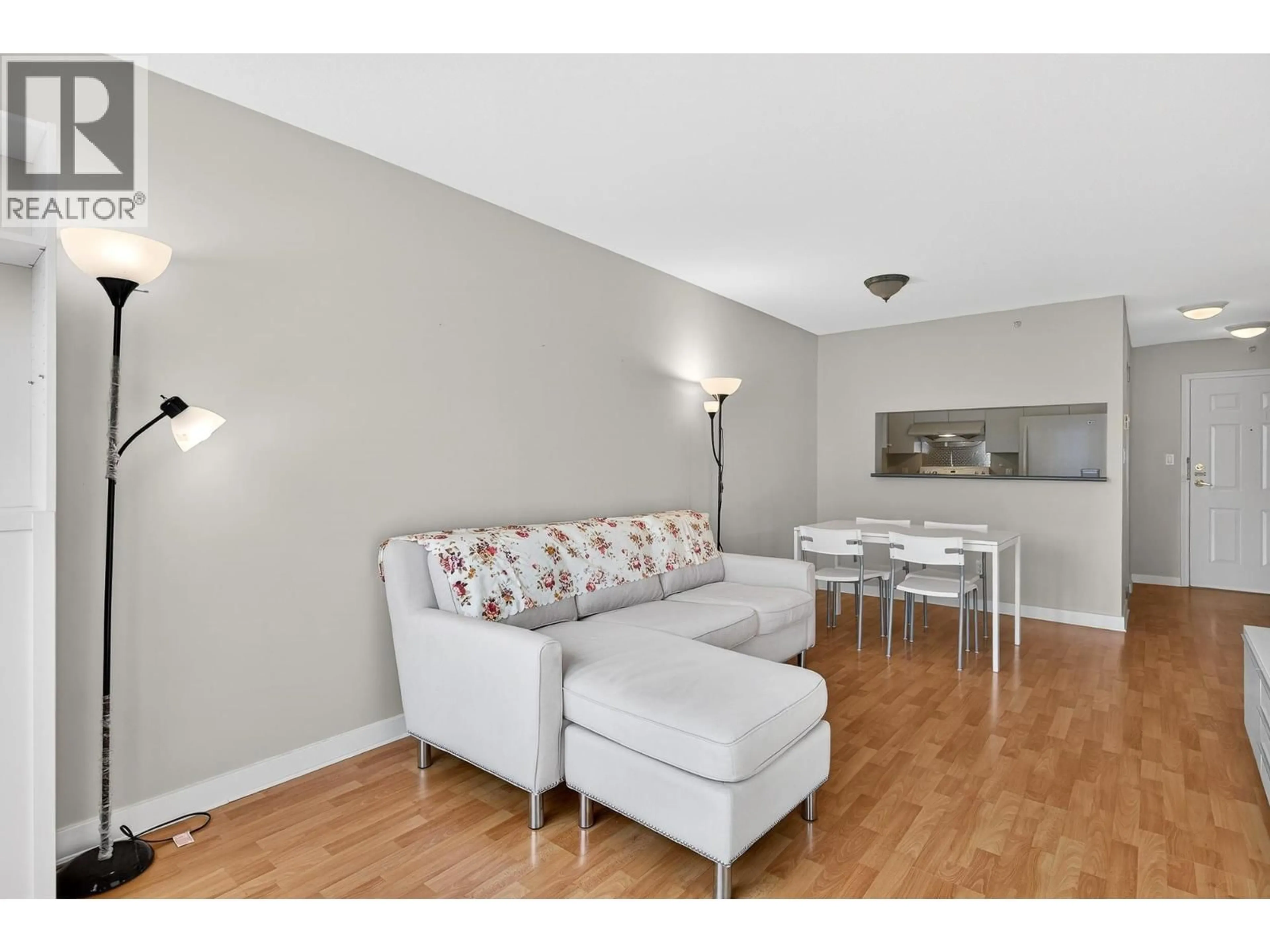 Living room with furniture, wood/laminate floor for 1201 - 5189 GASTON STREET, Vancouver British Columbia V5R6C7