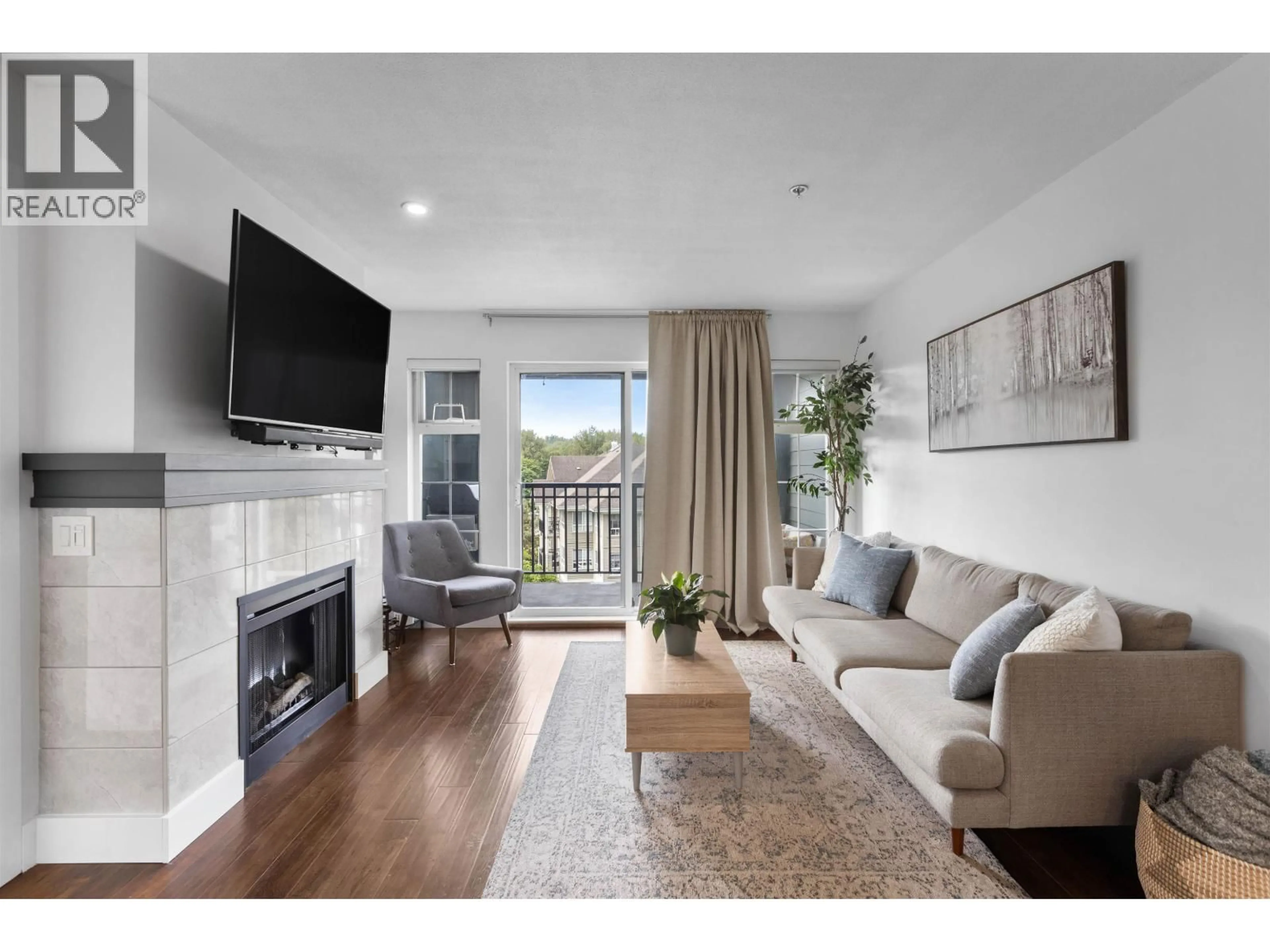 Living room with furniture, wood/laminate floor for 311 - 9098 HALSTON COURT, Burnaby British Columbia V3N0A6