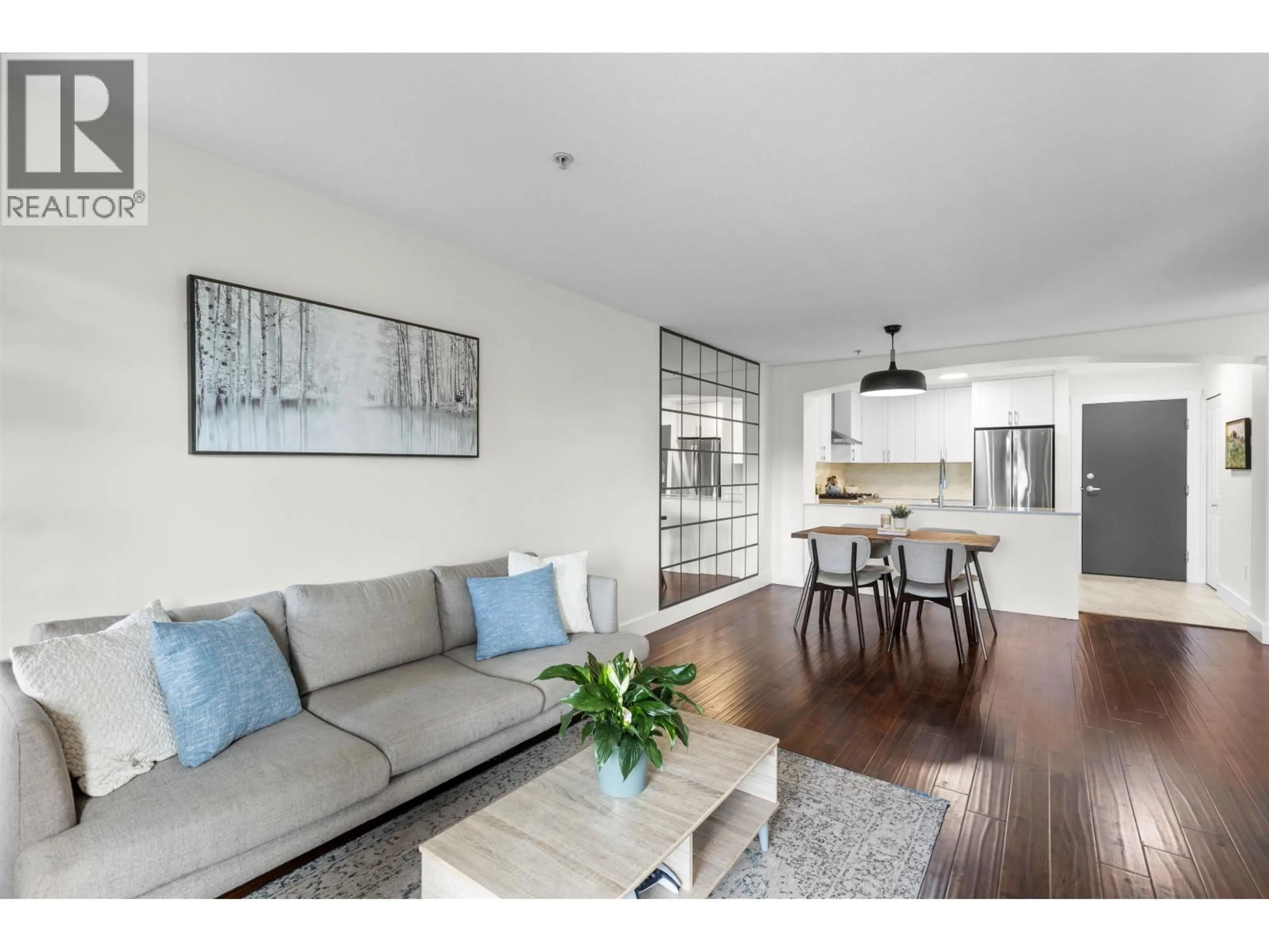 Living room with furniture, wood/laminate floor for 311 - 9098 HALSTON COURT, Burnaby British Columbia V3N0A6