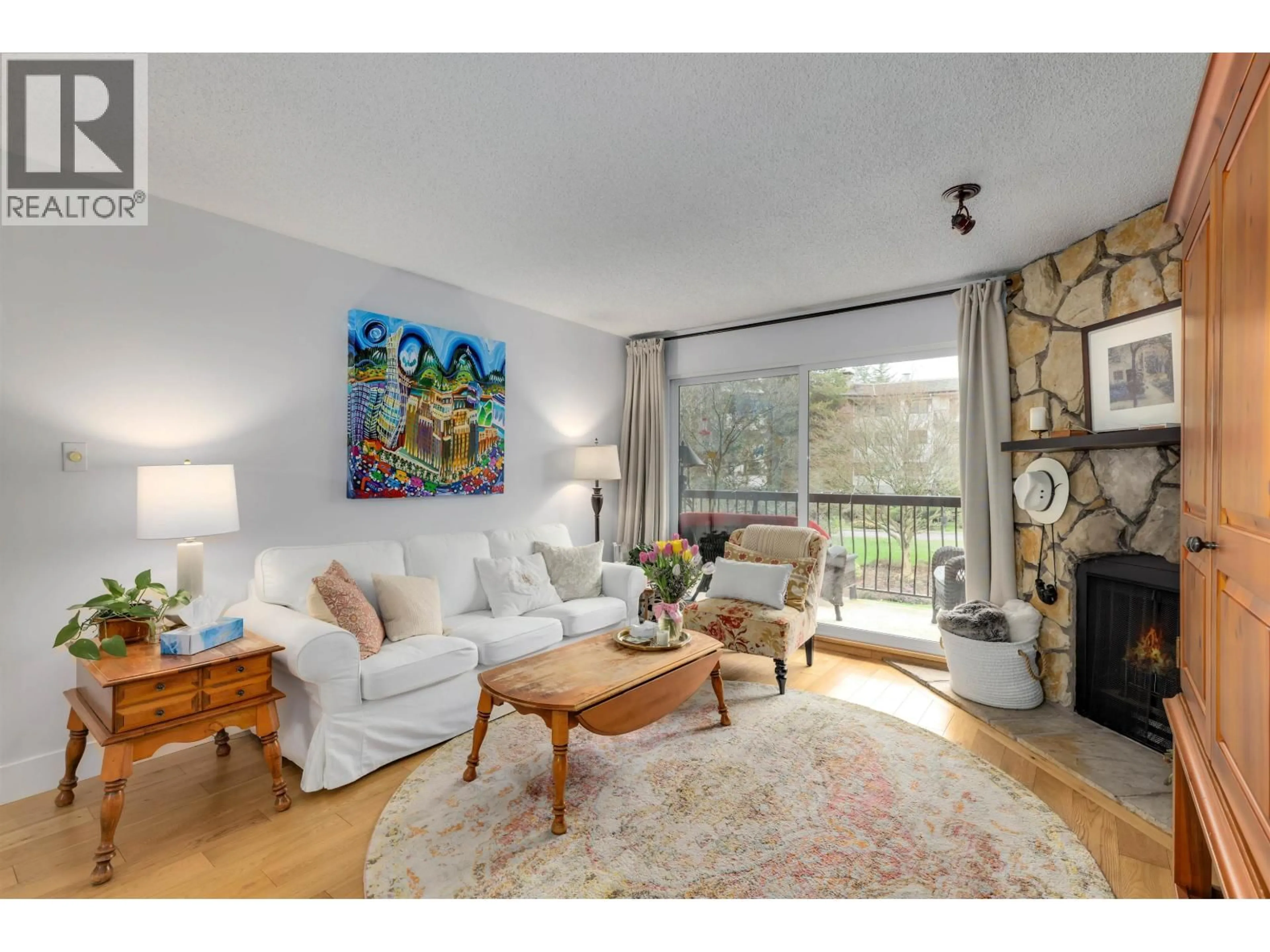Living room with furniture, wood/laminate floor for 102 - 10220 RYAN ROAD, Richmond British Columbia V7A4R1
