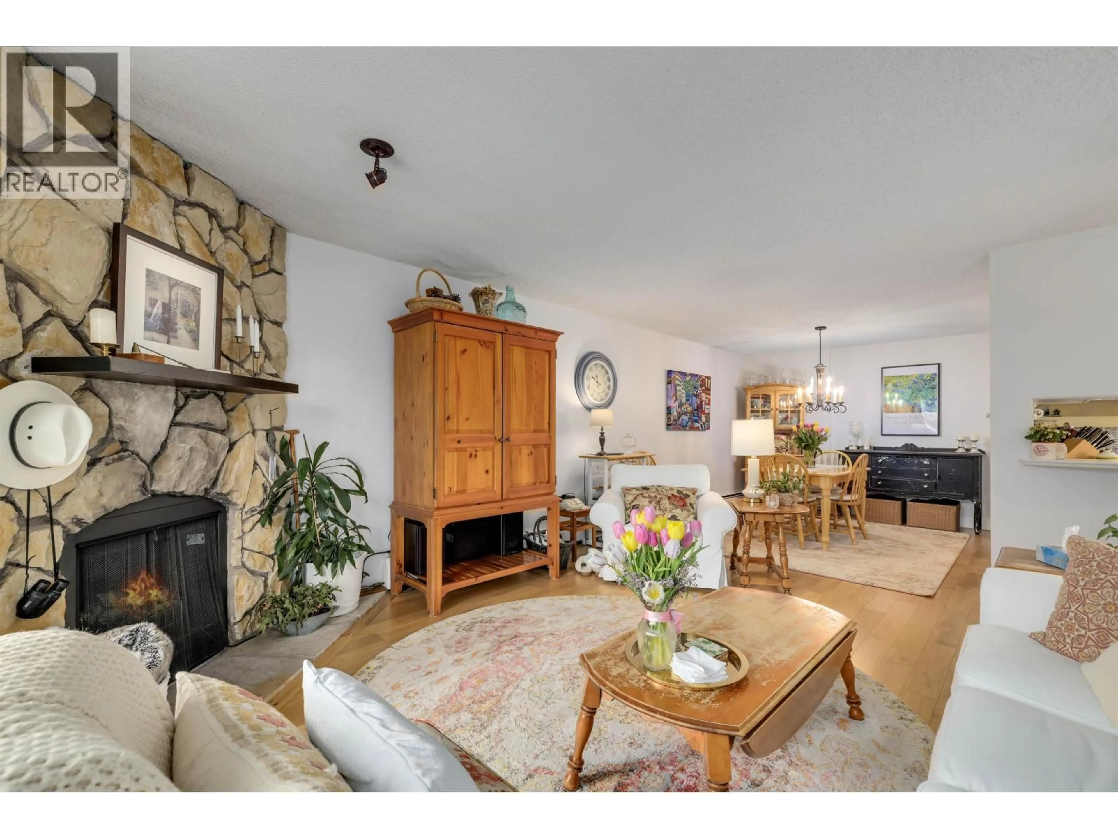 Living room with furniture, wood/laminate floor for 102 - 10220 RYAN ROAD, Richmond British Columbia V7A4R1