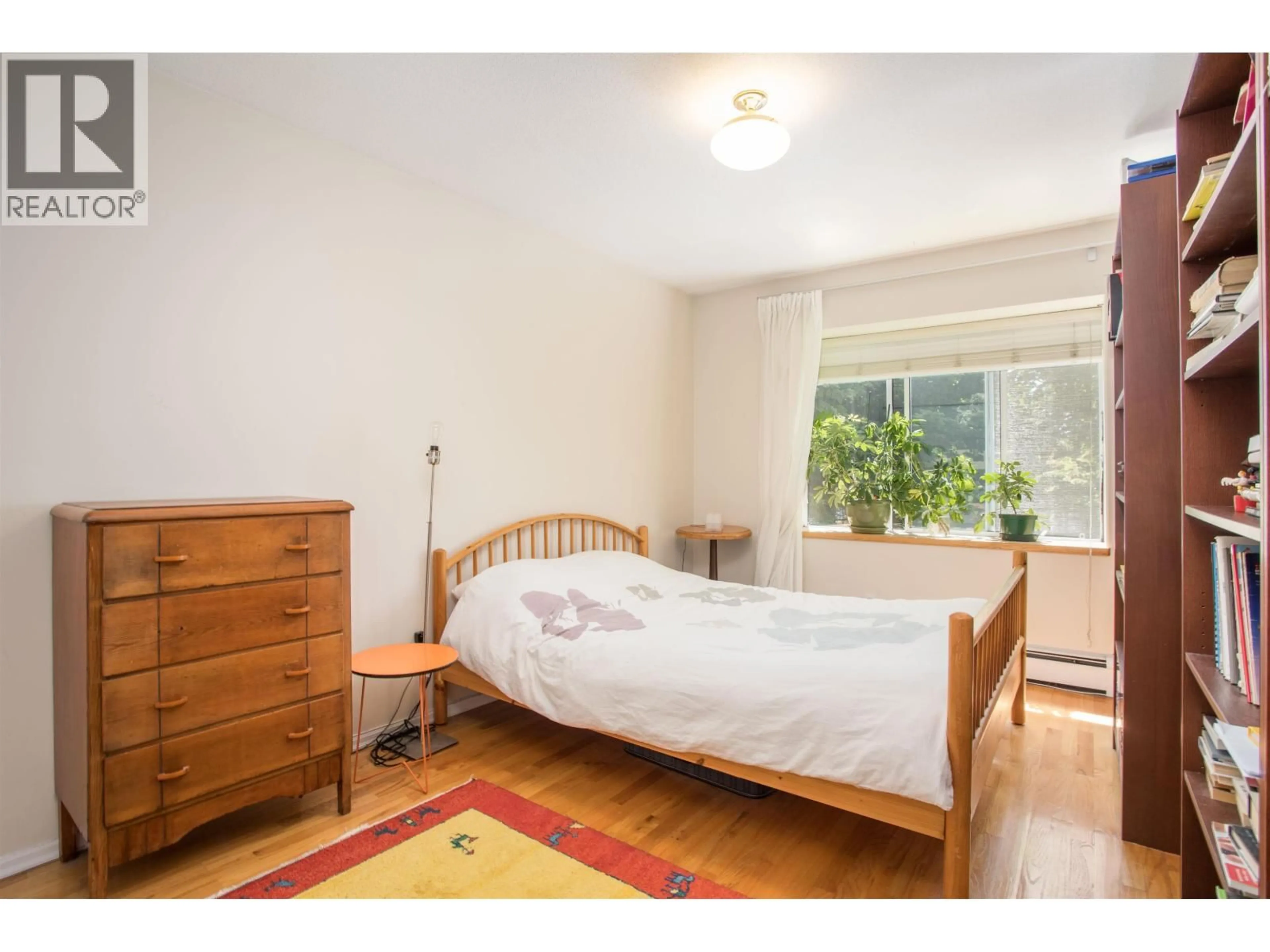 Bedroom with bed, wood/laminate floor for 2945 12TH AVENUE, Vancouver British Columbia V6K2R2