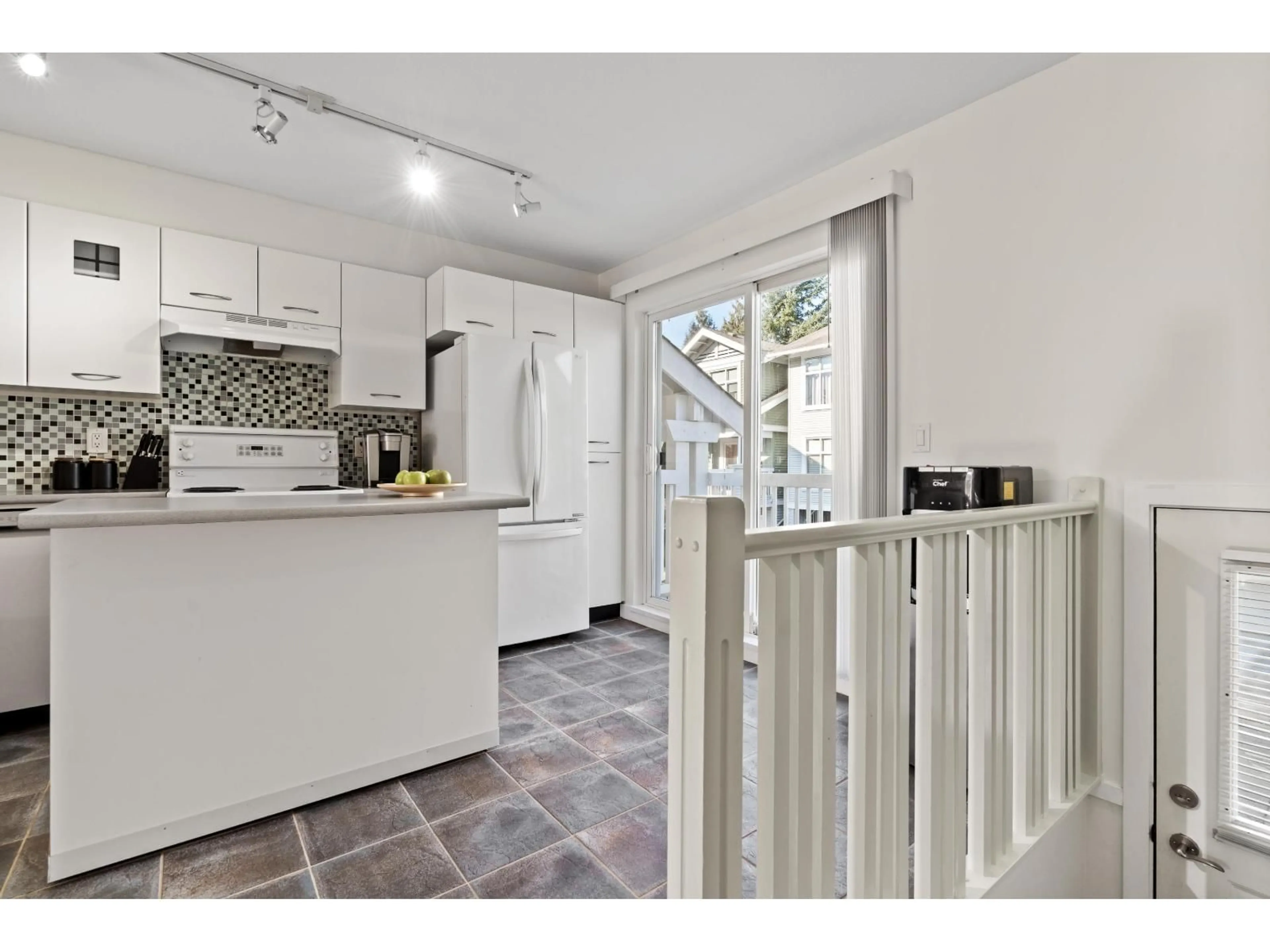 Open concept kitchen, ceramic/tile floor for 205 - 20033 70 AVENUE, Langley British Columbia V2Y3A2